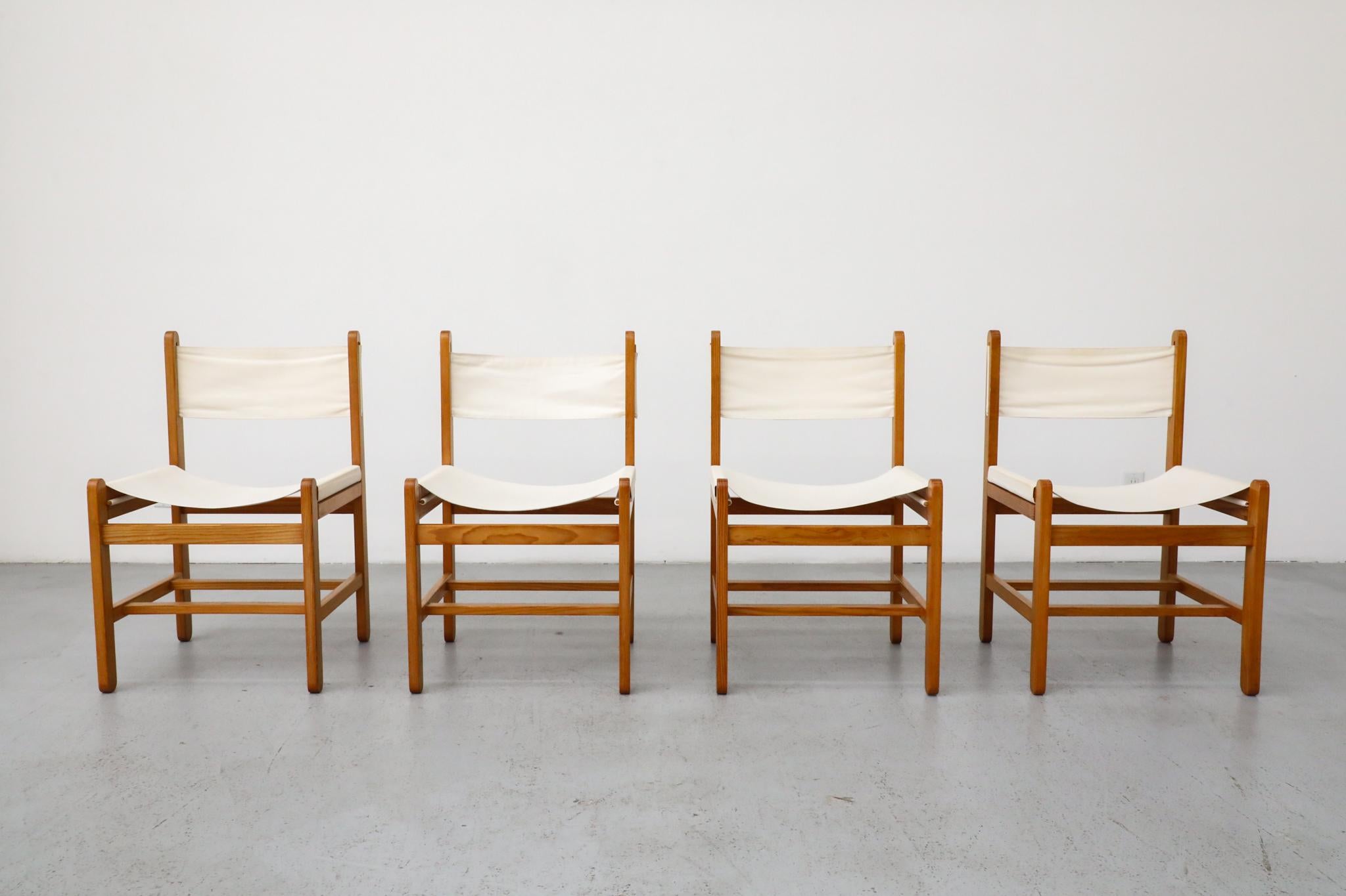 A remarkable set of four safari chairs designed by Peter Ole Schiønning for the renowned Danish manufacturer Niels Eilersen, likely produced in the 1960s. These chairs are a testament to Danish design's commitment to comfort, functionality, and