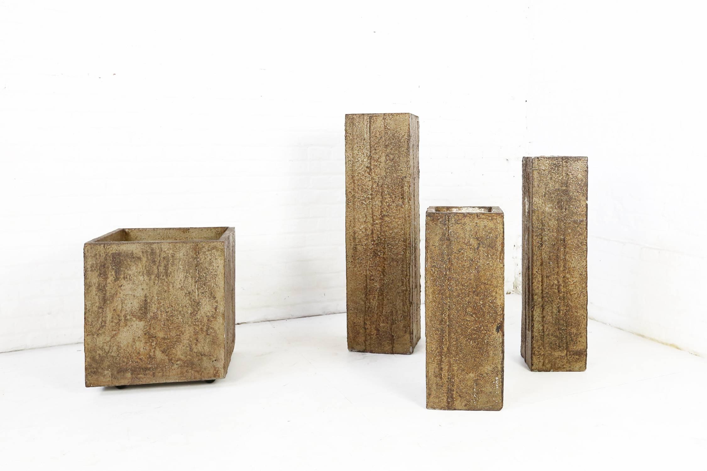 This one of a kind Pia Manu patinated concrete planters were made for a private home in Belgium

Dimensions: 40 x 40 x 45cm
 24 x 24 x 85cm
 22 x 22 x 55 cm
 19 x 19 x 70cm

Pia Manu is a workshop from Ingelmunster, Belgium founded by Jules