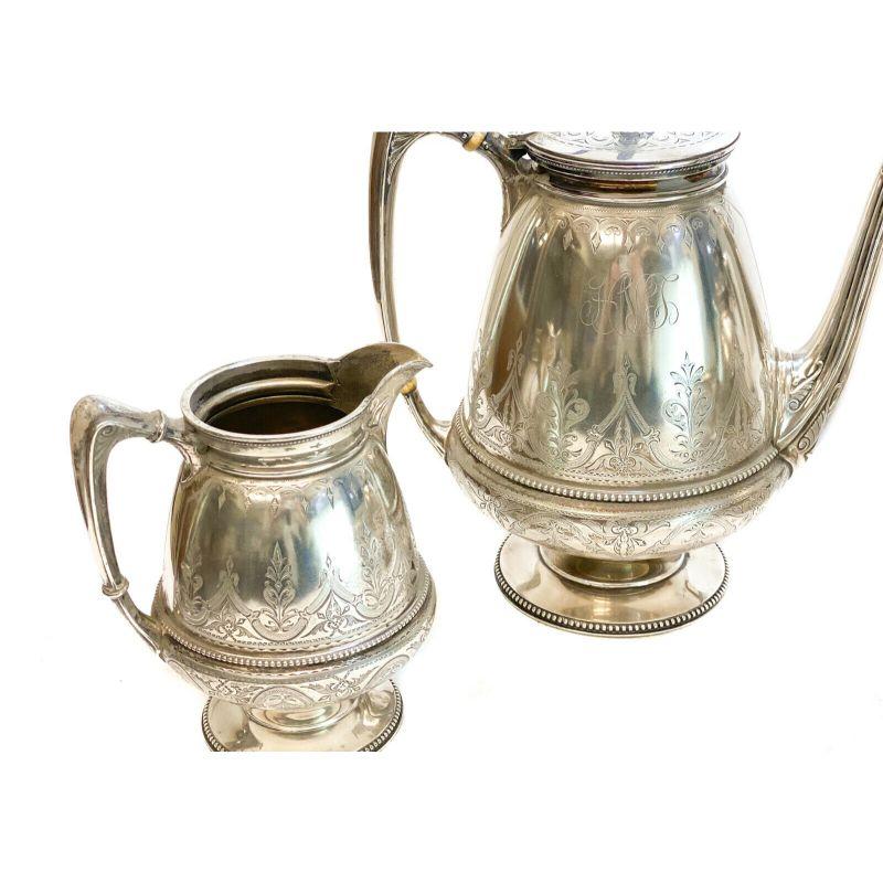 Set of 4 Piece Tea Serving Sterling Silver Whiting Manufacturing Co, circa 1880

Beaded accents around the rim to the top and base with hand chased foliate scroll accents. A 3 letter monogram to the central area.

The tea service set includes: