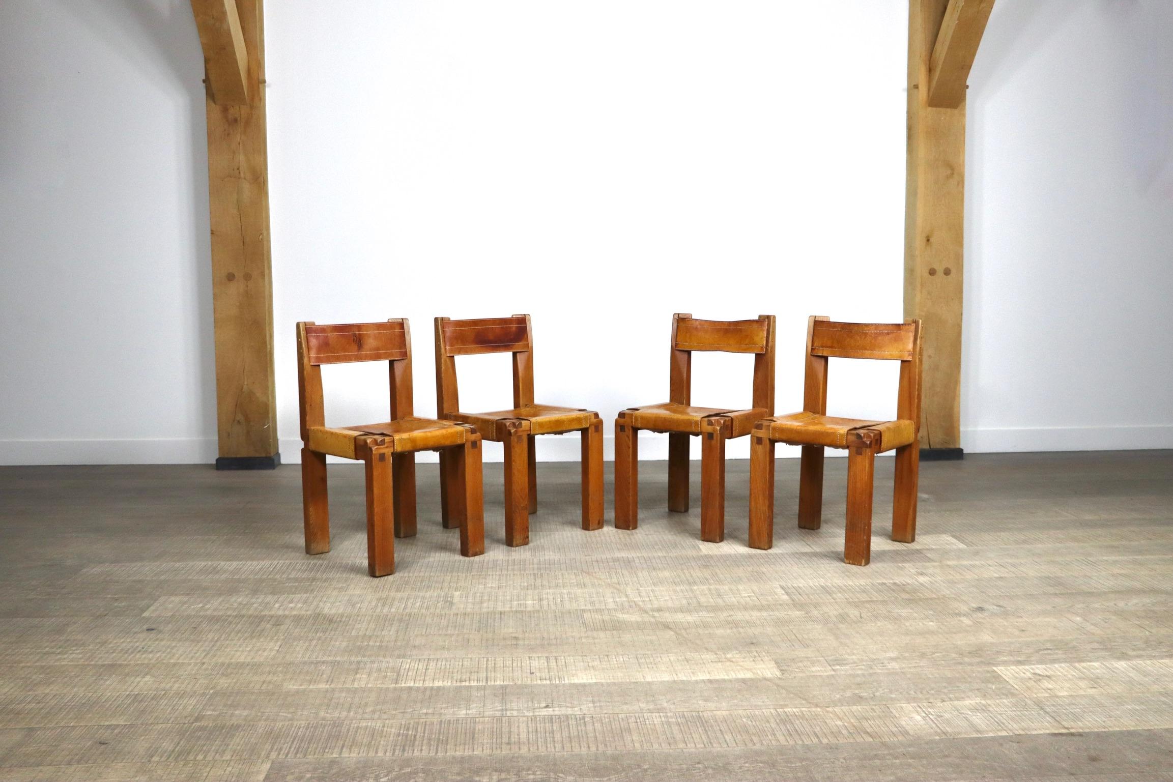 Incredible set of 6 model S11 dining chairs by the French designer Pierre Chapo. 
The absolutely stunning design with the iconic Chapo trademark wood joints which were created as a result of the pioneering 48 x 72 assembly ratio. The thick cognac