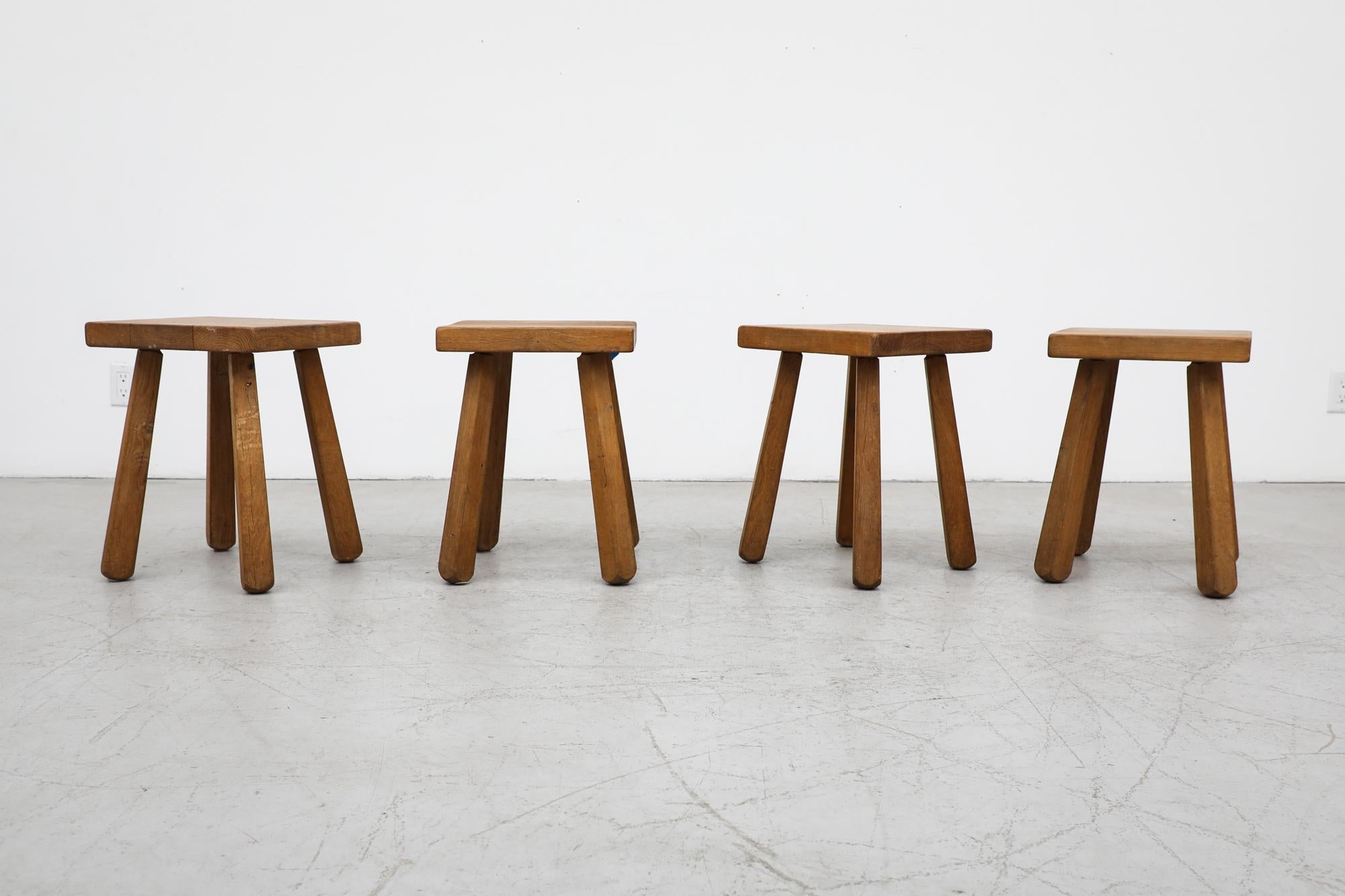 Set of 4 Mid-Century Pierre Chapo inspired solid oak stools. Perfect little side tables or side stools. In original condition with a handsome vintage patina. Their wear is consistent with their age and use. Note that the tops are imperfect with some