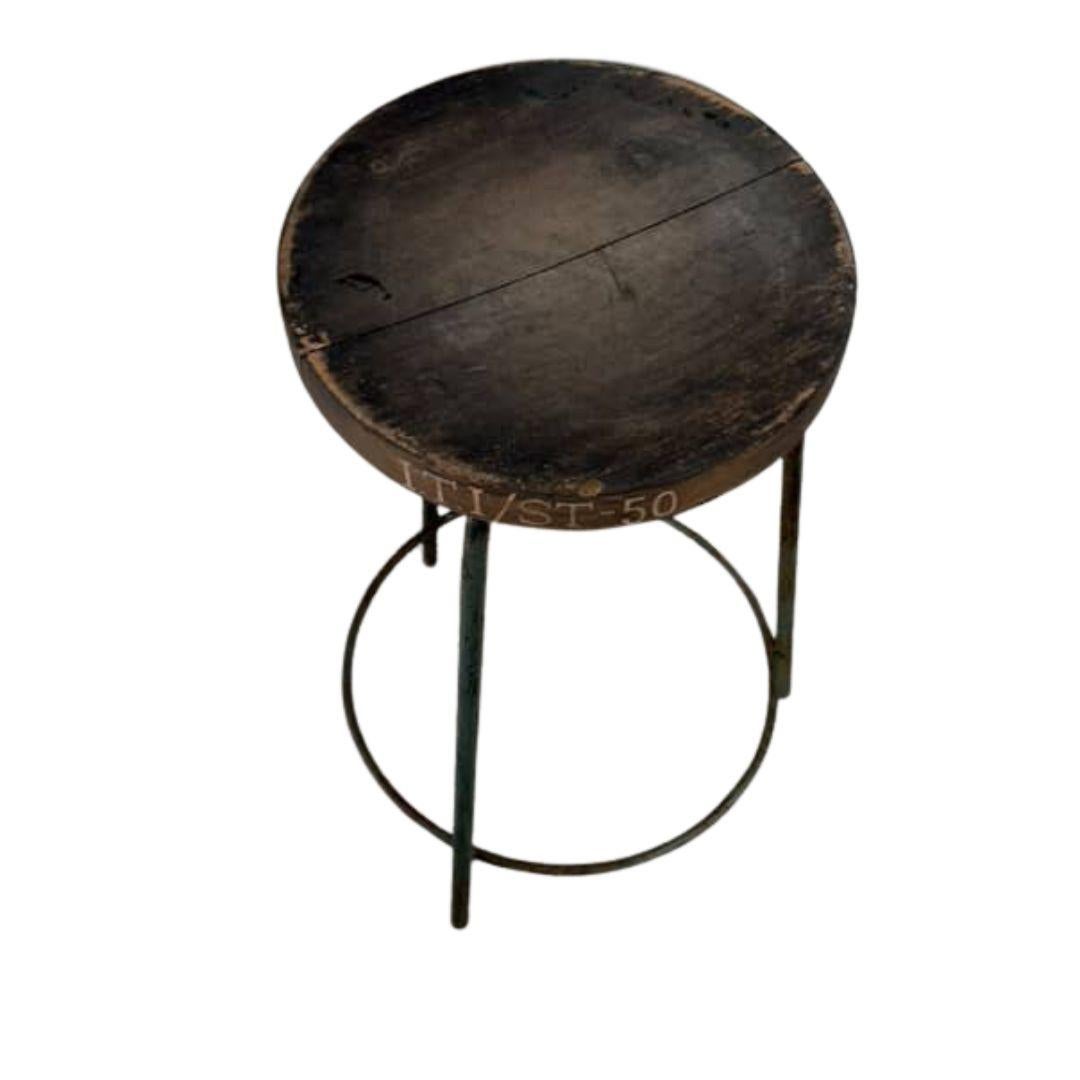 Authentic set of 4 Pierre Jeanneret PJ-SI-57-A stools crafted from solid teak and welded iron, featuring a distinctive round tripod base and a subtly concave seat. All stools have their original markings.

P.U. Bio. -20
P.U. Bio. -87
P.U. Bio.