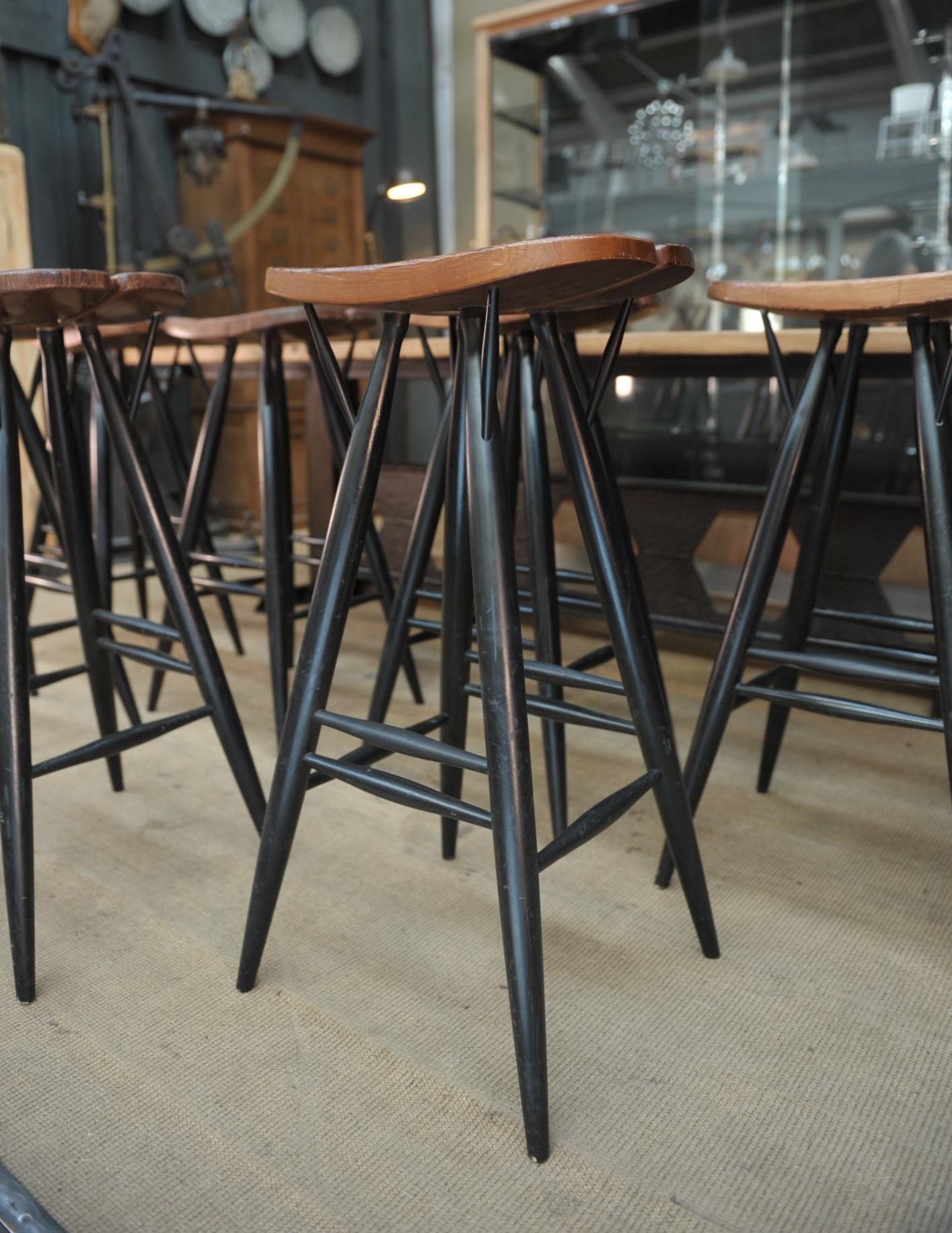 Set of 4 pirkka bar stool by Ilmari Tapiovaara in beech wood frame and pine seat, circa 1980.