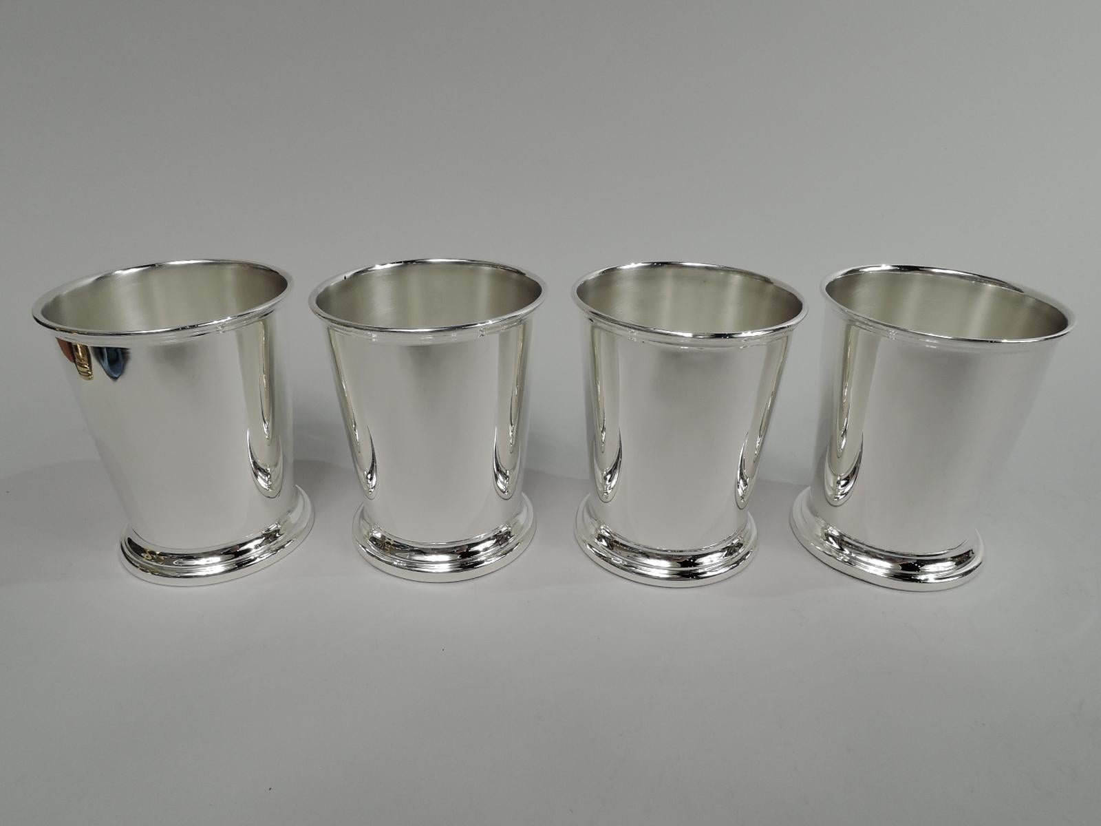 Set of 4 sterling silver mint julep cups. Made by Poole Silver Co. in Taunton, Mass. Each: Straight and tapering sides, molded rim, and skirted foot. All marked “Sterling”. Three have maker’s stamp and no. 58. Total weight: 11.5 troy ounces.