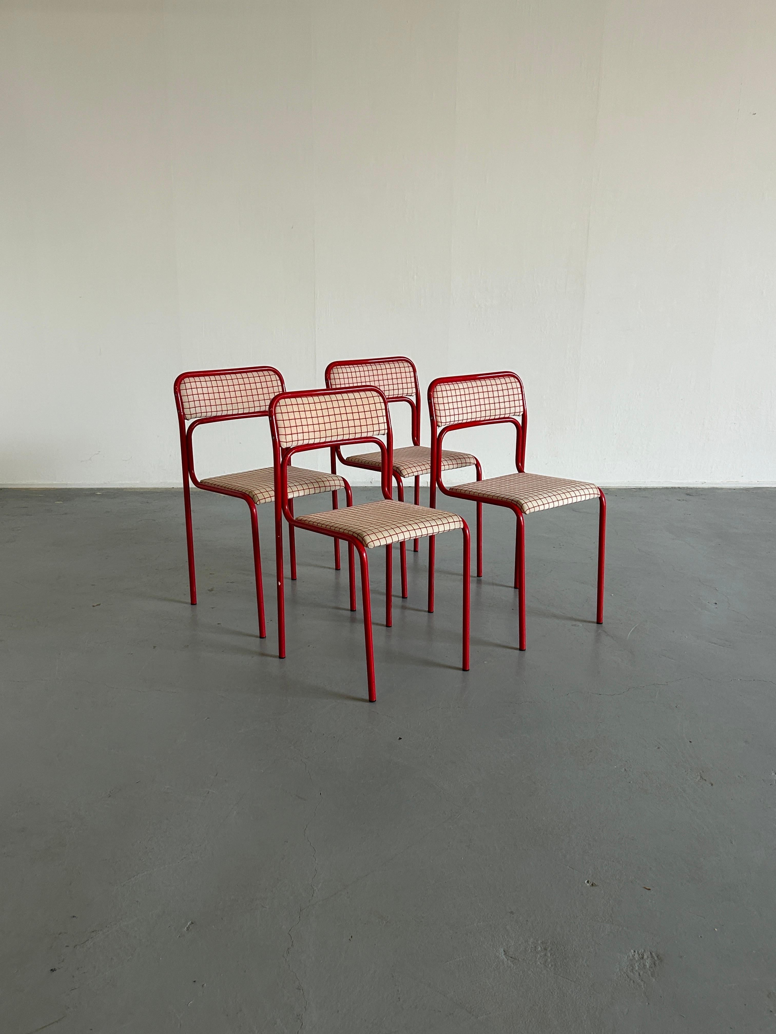 Pop-art style red-white checkered upholstery modernist chairs.
Painted tubular steel base, wooden upholstered seat and backrest.
Stackable.

In good vintage condition with expected signs of age.
Upholstery with signs of wear and some stains, but