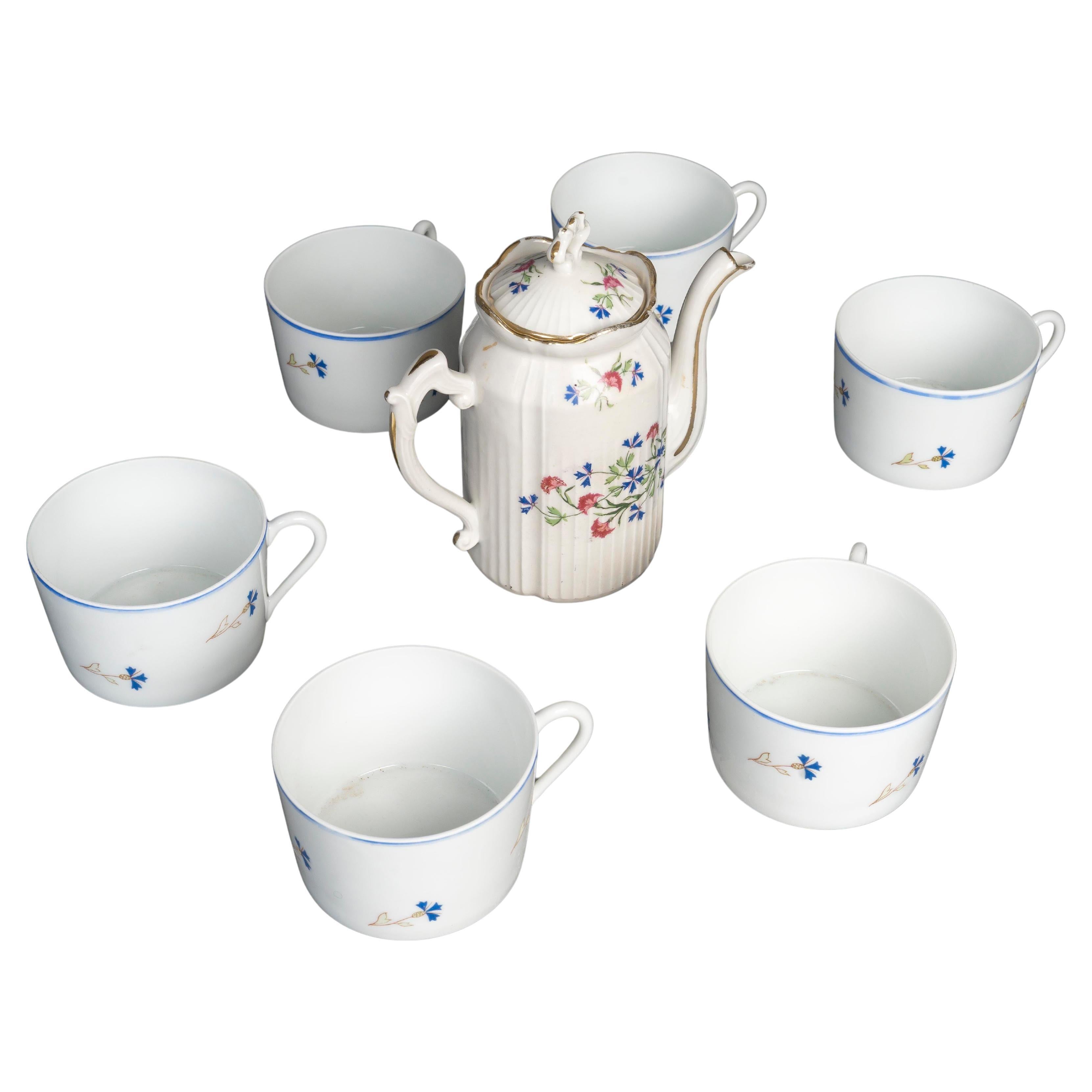 Set of 4 Porcelain Cups and Coffee Pot.