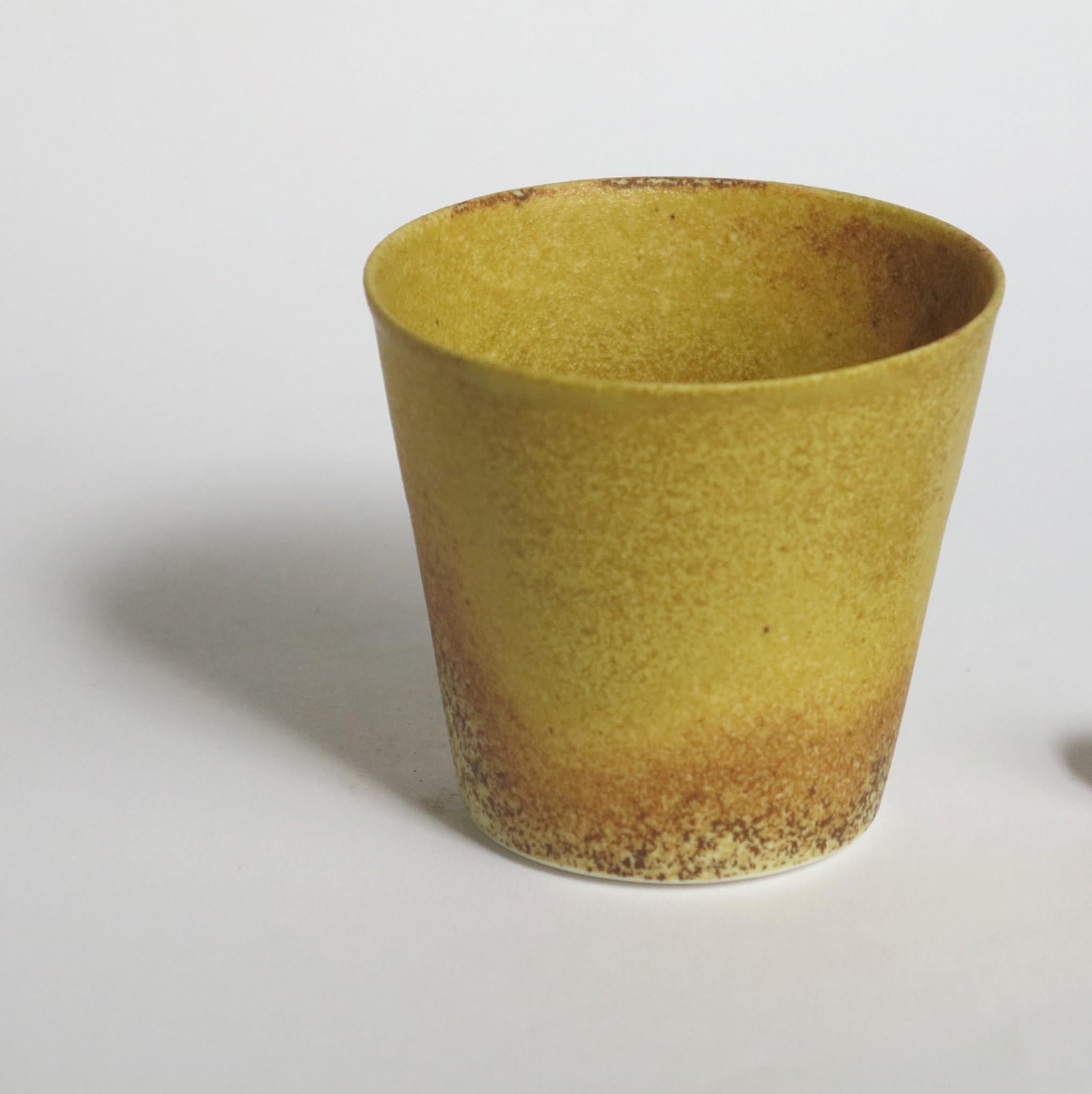 Set of 4 porcelain yellow coffee cups by Cica Gomez
Price for set of 4.
Dimensions: Ø 6.5 x H 6 cm
Materials: Porcelain

Usual objects. My work is first driven by the search for the line. The one that it draw when the object takes shape and