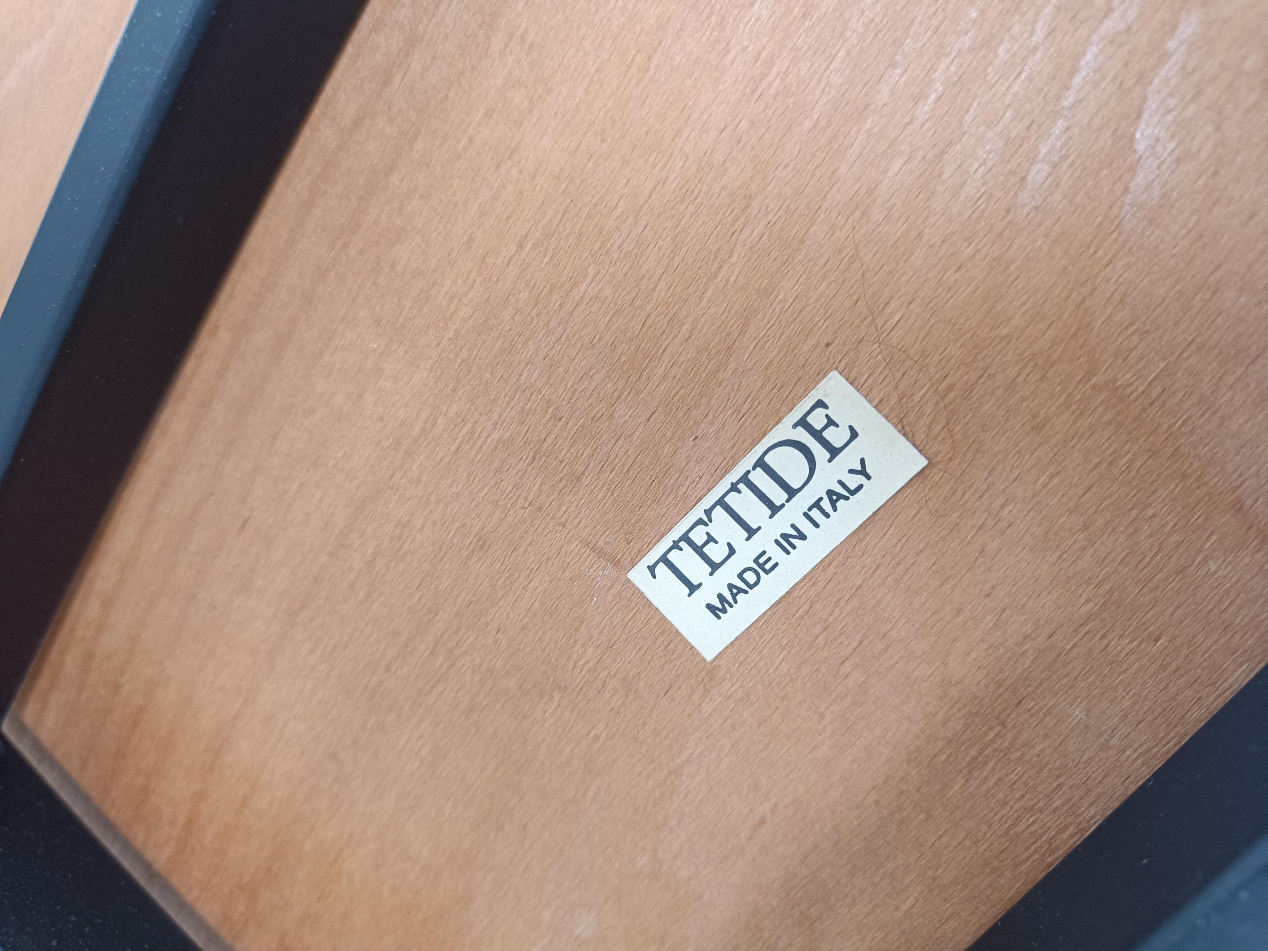 Set of 4 post modern dining chairs produced by Tetide.

Nice sleek design with a black metal frame, perforated backrest and wooden seats and armrests.

The chairs are labelled.

Good condition

1980s - Italy

Dimensions:
Height: 75cm/29.52