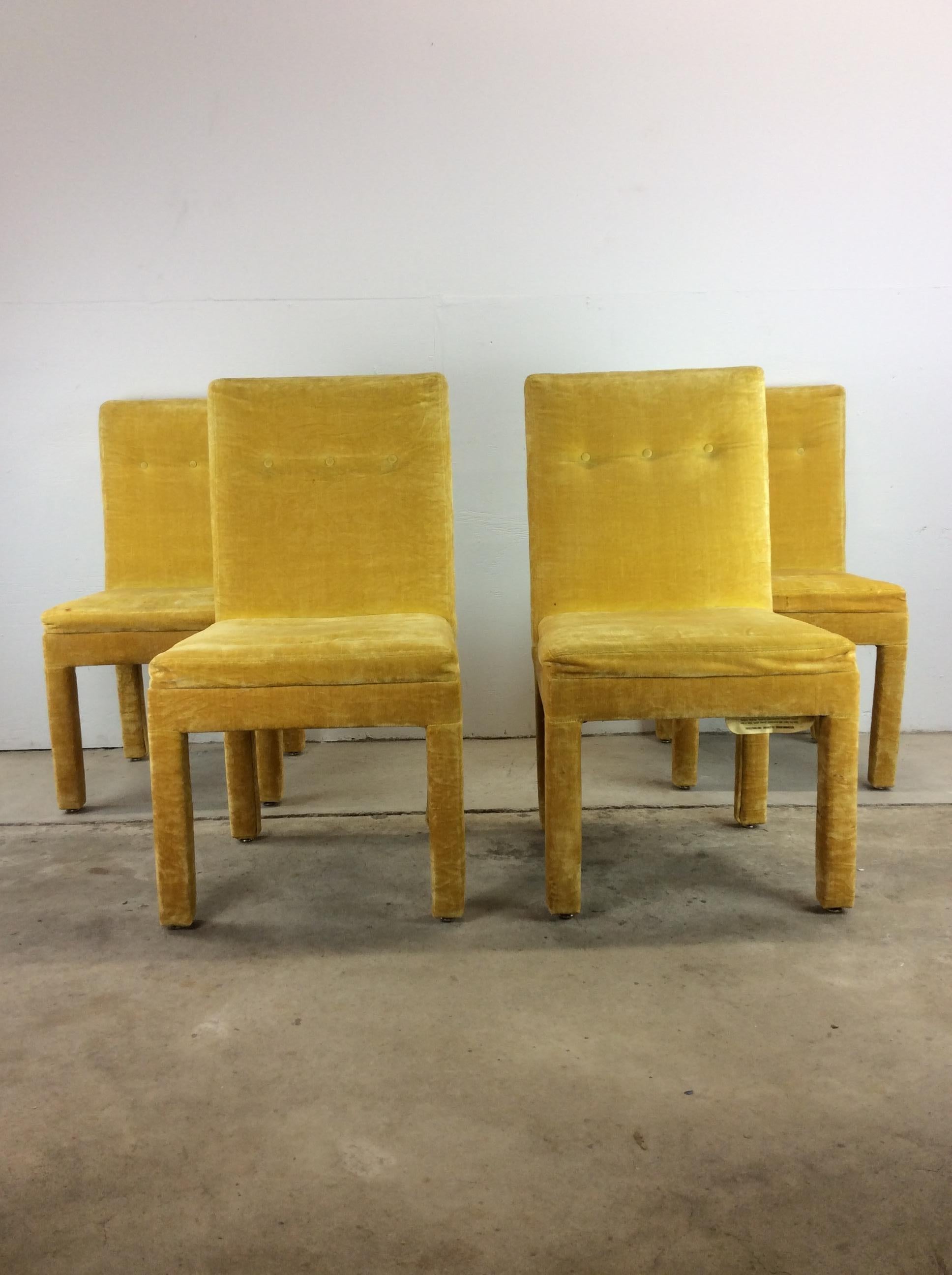This set of 4 postmodern dining chairs feature vintage yellow velour upholstery throughout, tufted seat backs and Parson's style design.

Complimentary glass & chrome dining table available separately. 

Dimensions: 20.5w 22d 38h 19sh

Condition: