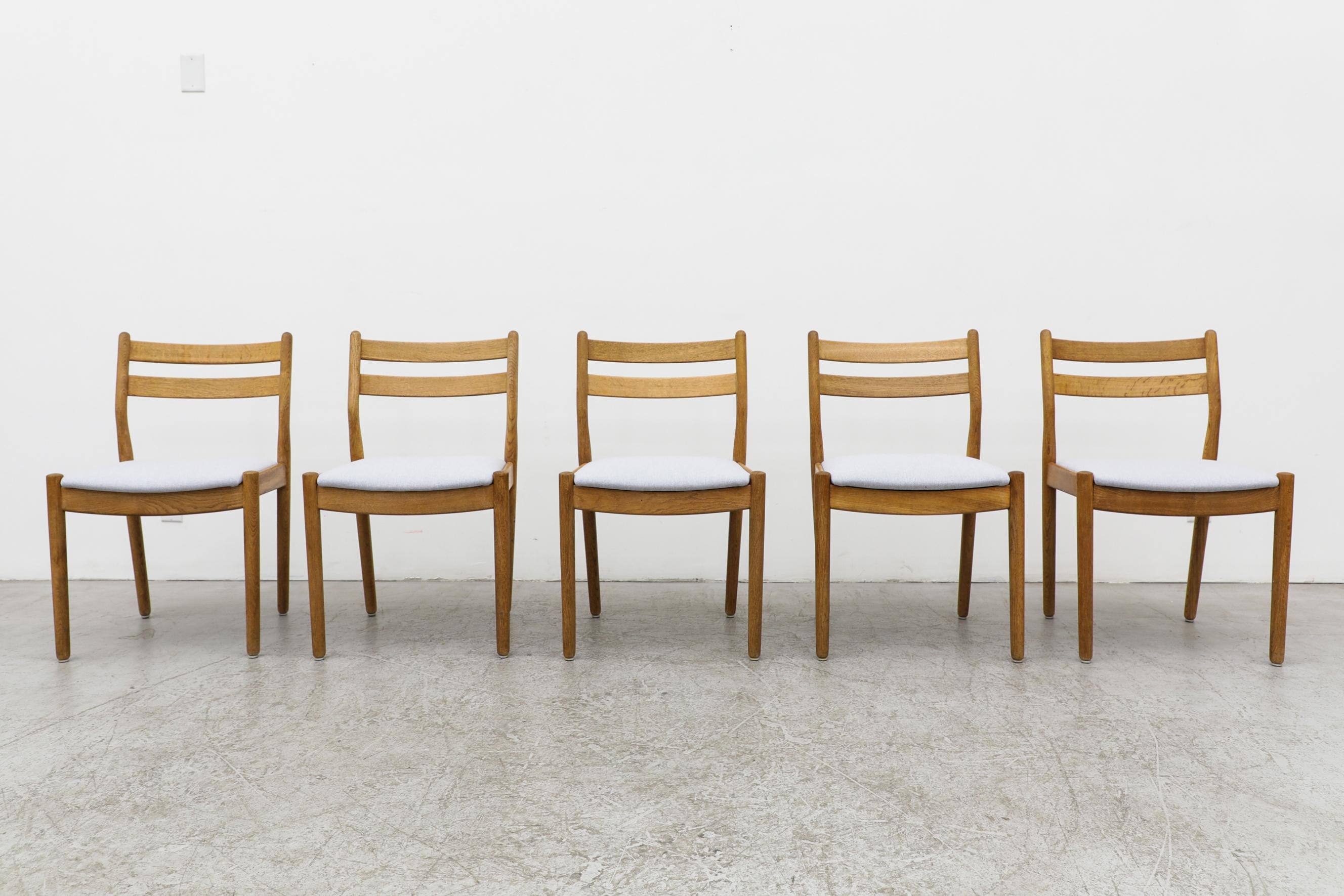 Set of 4 Poul Volther dining chairs with light blue upholstered seating. Poul M. Volther, a Danish furniture and lighting designer, lived from 1923 to 2001. Initially schooled as a cabinetmaker, Volther eventually earned an architecture degree from