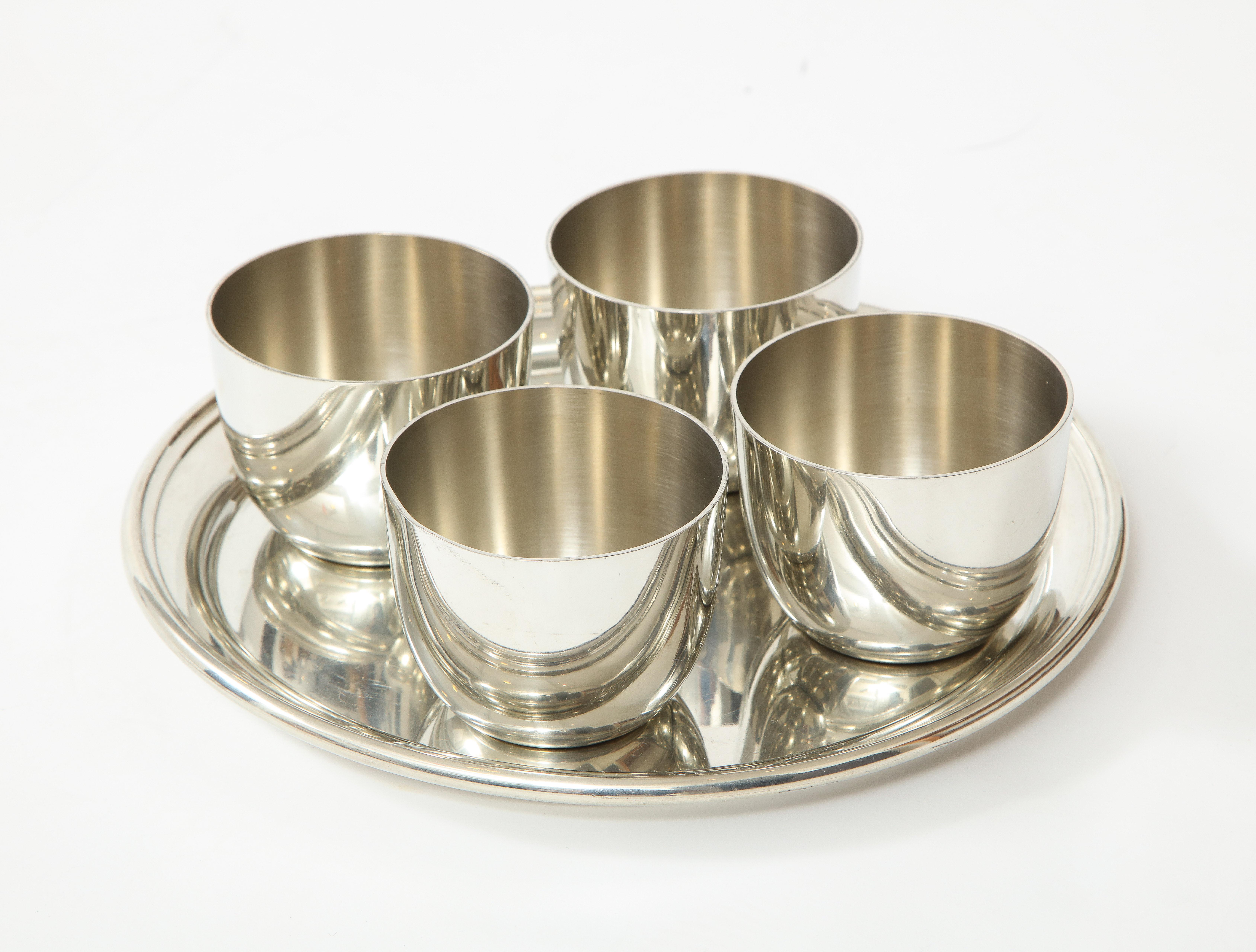 Wonderful midcentury set of pewter cups and serving tray, platter. Stamped.

Tray measures 10 inches in diameter x .5 deep
Cups measure 3.25 inchres in diameter x 2.5 inches tall