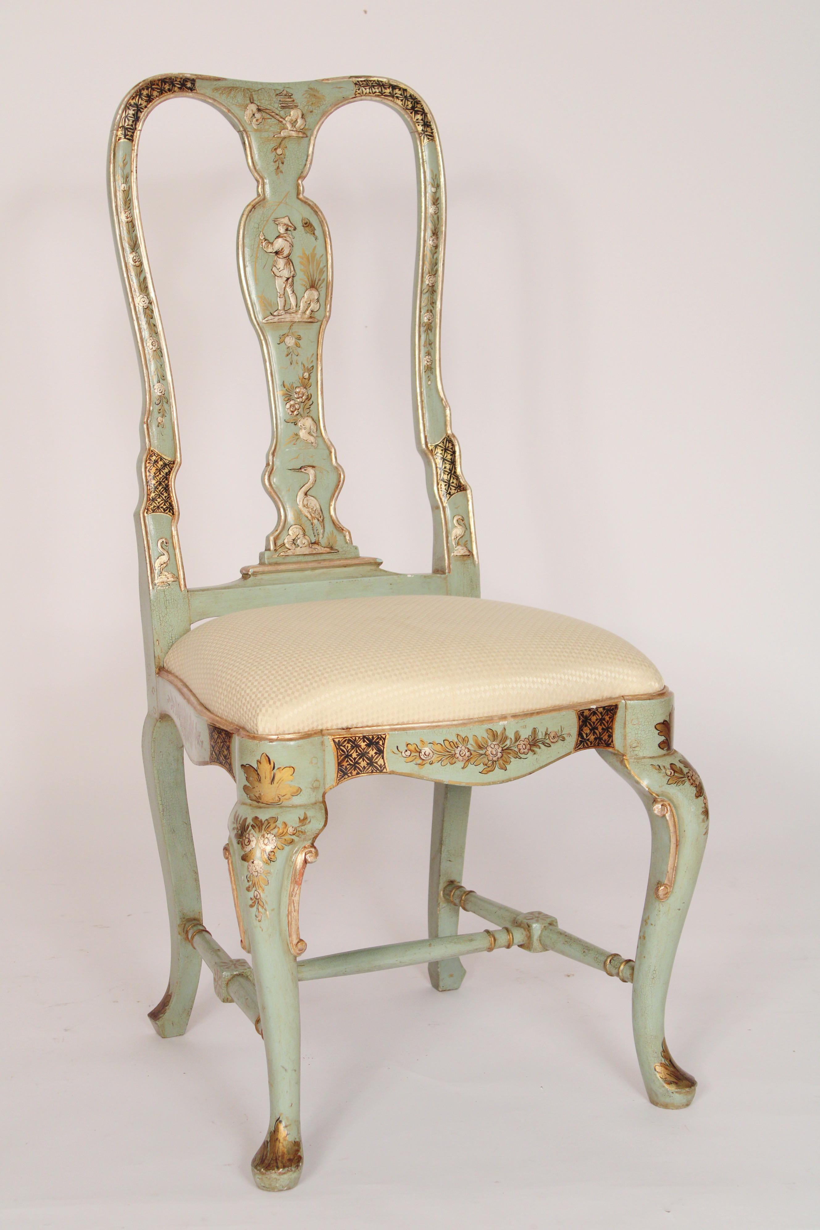 Set of 4 Queen Anne Style chinoiserie  decorated side chairs, circa 1930's. With sea foam green and raised silver leaf decoration, vase shaped back splats each back splat with figures in different pursuits, fisherman etc. , resting on cabriole legs