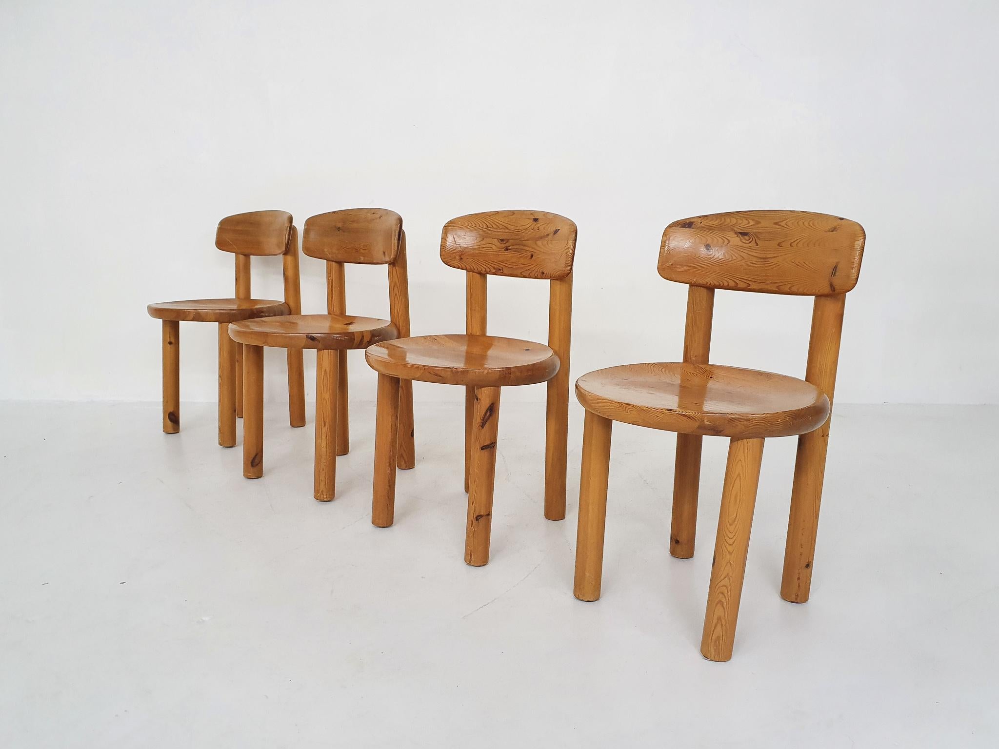 Solid pinewood dining chairs with tiltable back. Some traces of use.
