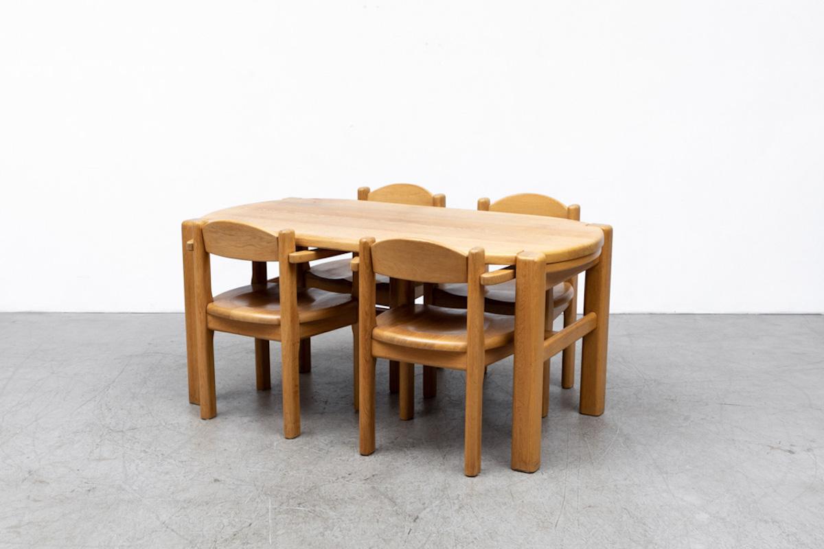 Set of 4 Rainer Daumiller style oak dining chairs. In original condition, with some wear consistent with age and use. Set Price. Shown with matching Heavy Blonde Oak Dining Table with Trestle Base (LU922425237012). Listed separately.