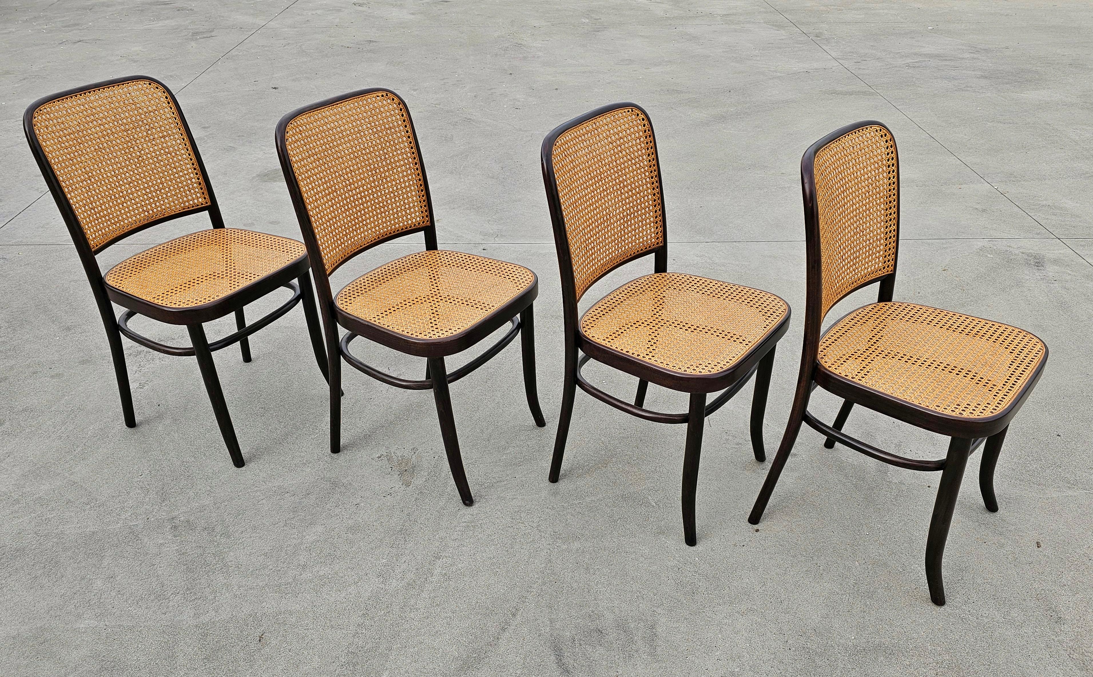In this listing you will find a set of rare vintage dining chairs designed by Josef Hoffmann for Mundus. The frame of the chairs is done in beech bentwood and painted in black with cane seats and backrest.

Chairs were manufactured by Mundus