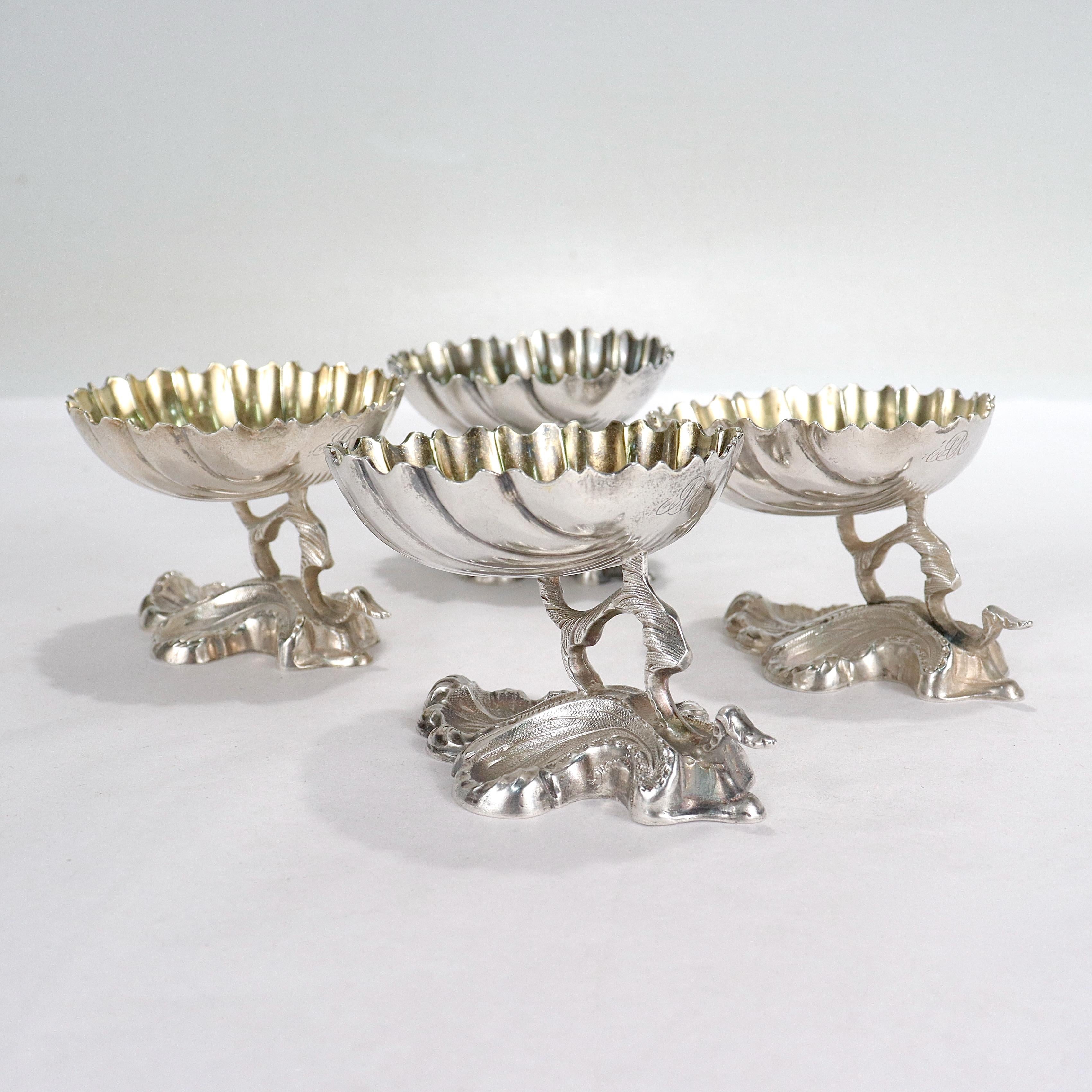 A fine set of 4 silver salt cellars.

By R&W Wilson.

In coin silver.

With shell shaped bowls supported on shaped feet. 

Each with an 