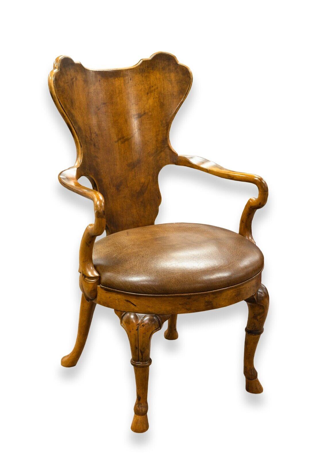 A set of 4 reproduction English Georgian walnut armchairs by Century Furniture. An amazingly sculpted set of 4 traditional armchairs. These wonderful chairs feature a walnut wood construction with a light brown leather seat. The sculpted wood frame