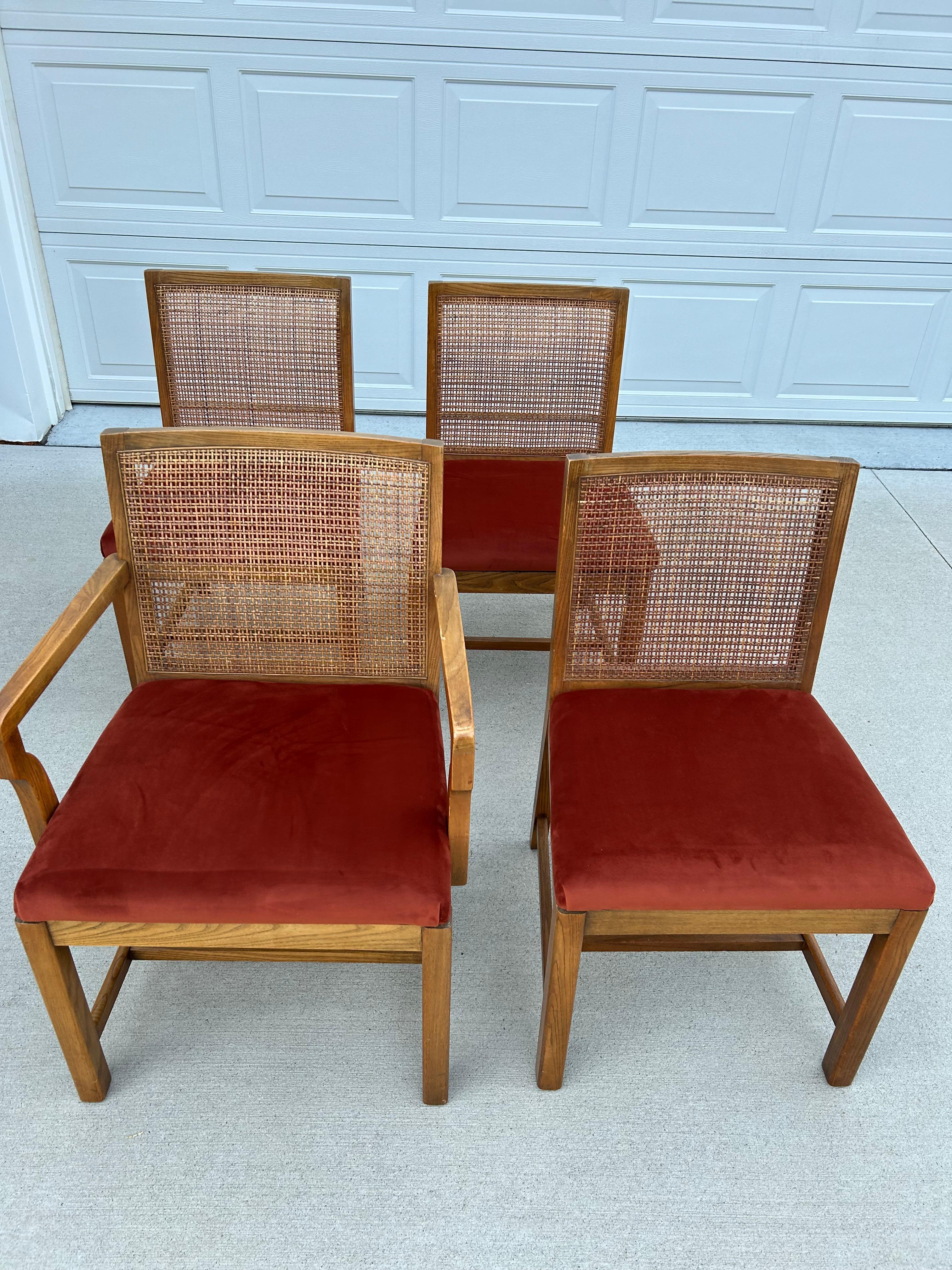 Beautiful set of boho chic cane back dining chairs by American Martinsville. This set includes 3 armless/side chairs and one arm chair. The chairs are in good condition, there are a few scratches due to age and a couple minor breaks in a couple of