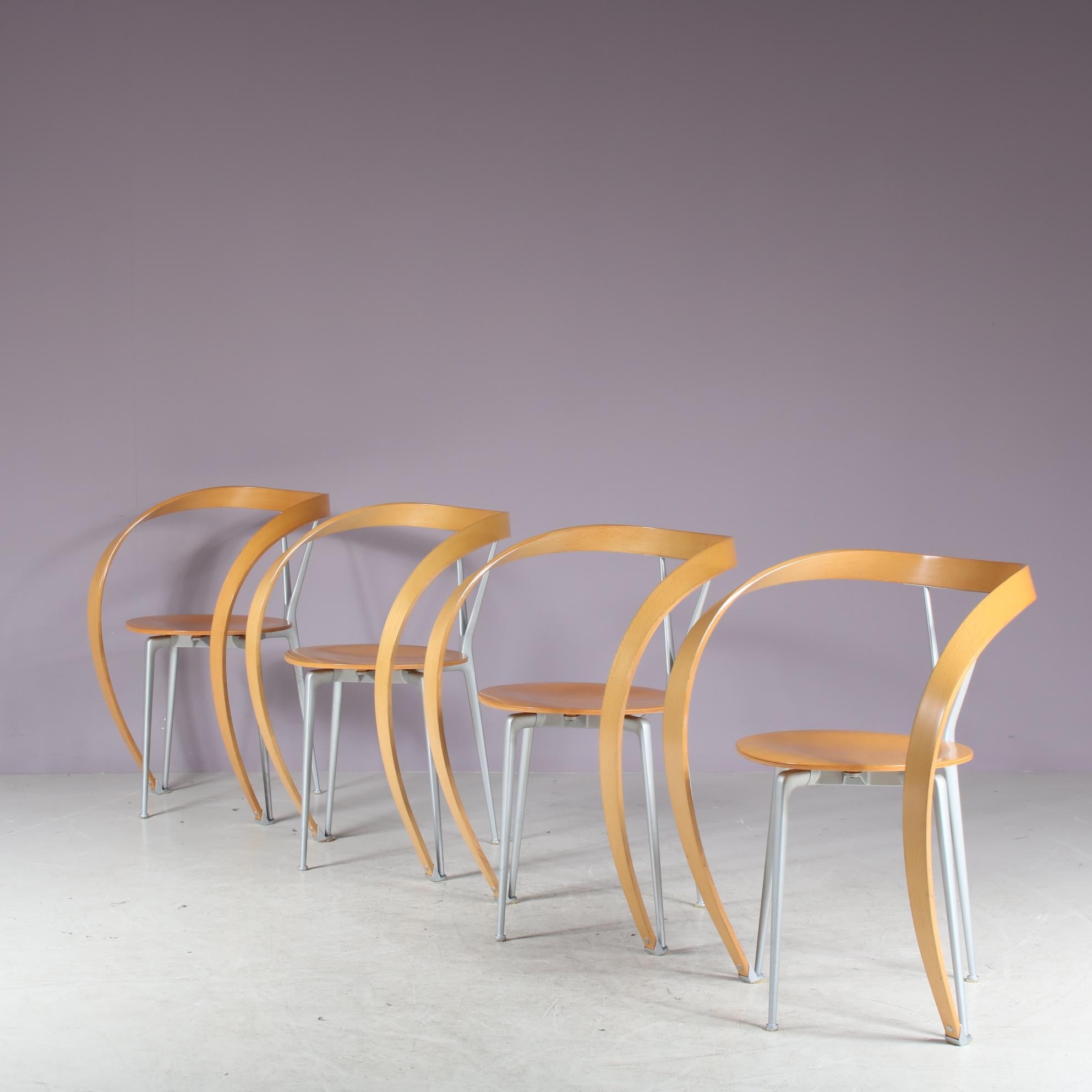 A beautiful set of four luxurious chairs, model “Revers”, designed by Andrea Branzi and manufactured by Cassina in Italy around 1990.

The main eye-catching feature of these chairs are the smoothly bent armrests. Each chair has an integrated