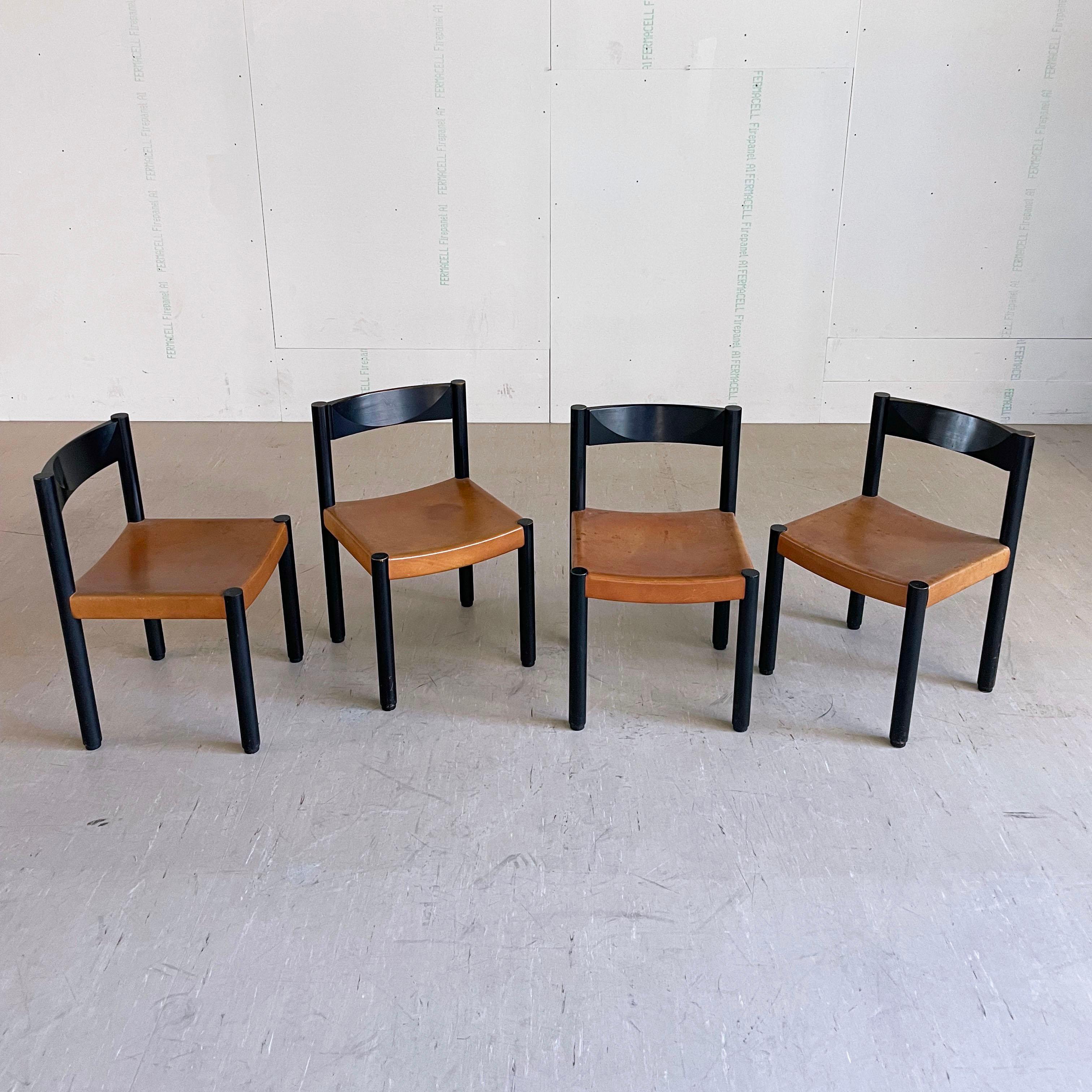 Set of 4 Robert Haussmann 'Stollenstuhl' Dining Chairs. Designed by Swiss Architect & Designer, Robert Haussmann, 1963 for Dietiker AG, Switzerland.  Brutalist design. Solid wooden frame & backrest with tanned leather seat. With considerable