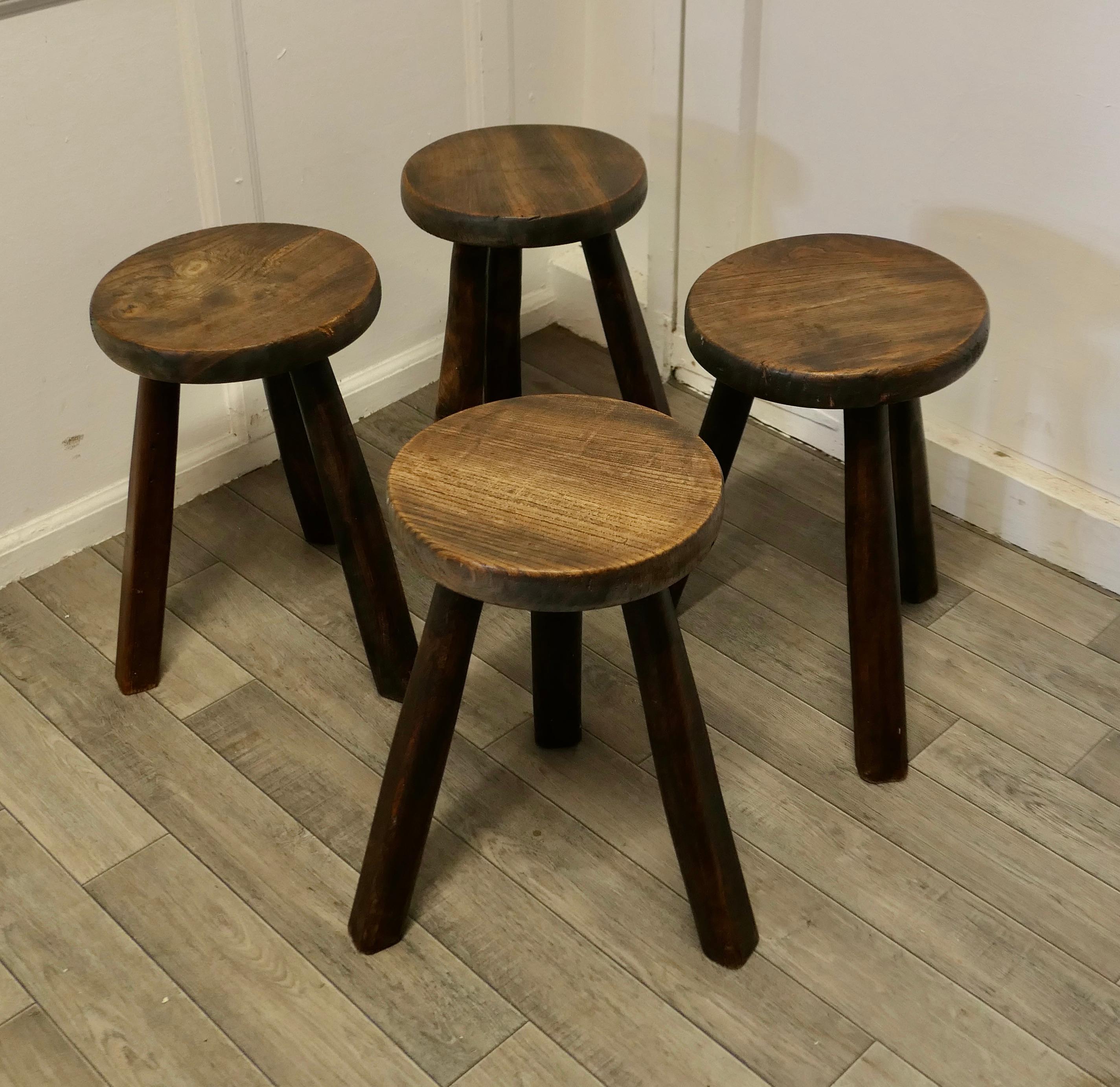 Set of 4 rustic handmade elm farmhouse kitchen stools

Beautiful handmade country pieces with a good patina, they have 2” thick Round elm seats with strong chunky legs 
The stools are sturdy and sound, the seats are 18” high and 12” in