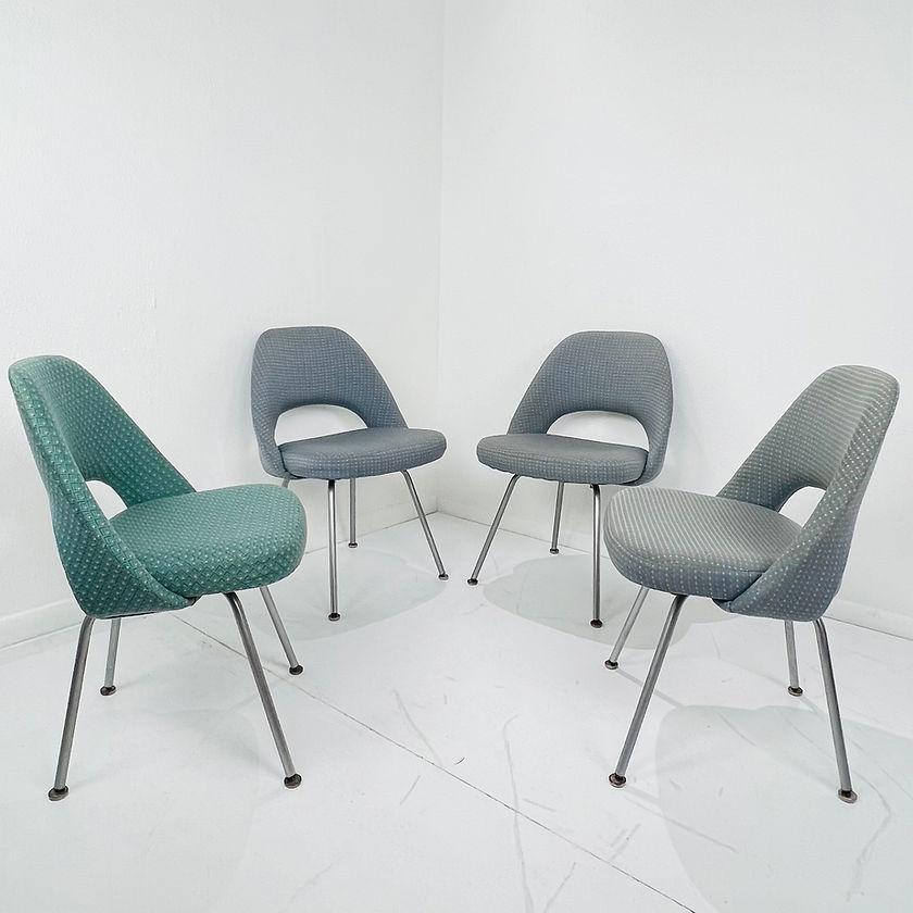 Set of 4 Model 72 executive chairs by Eero Saarinen for Knoll International. These feature a fluid, sculptural form with upholstered seats/back and steel frame/legs. This timeless and versatile design continues to fit seamlessly into work,