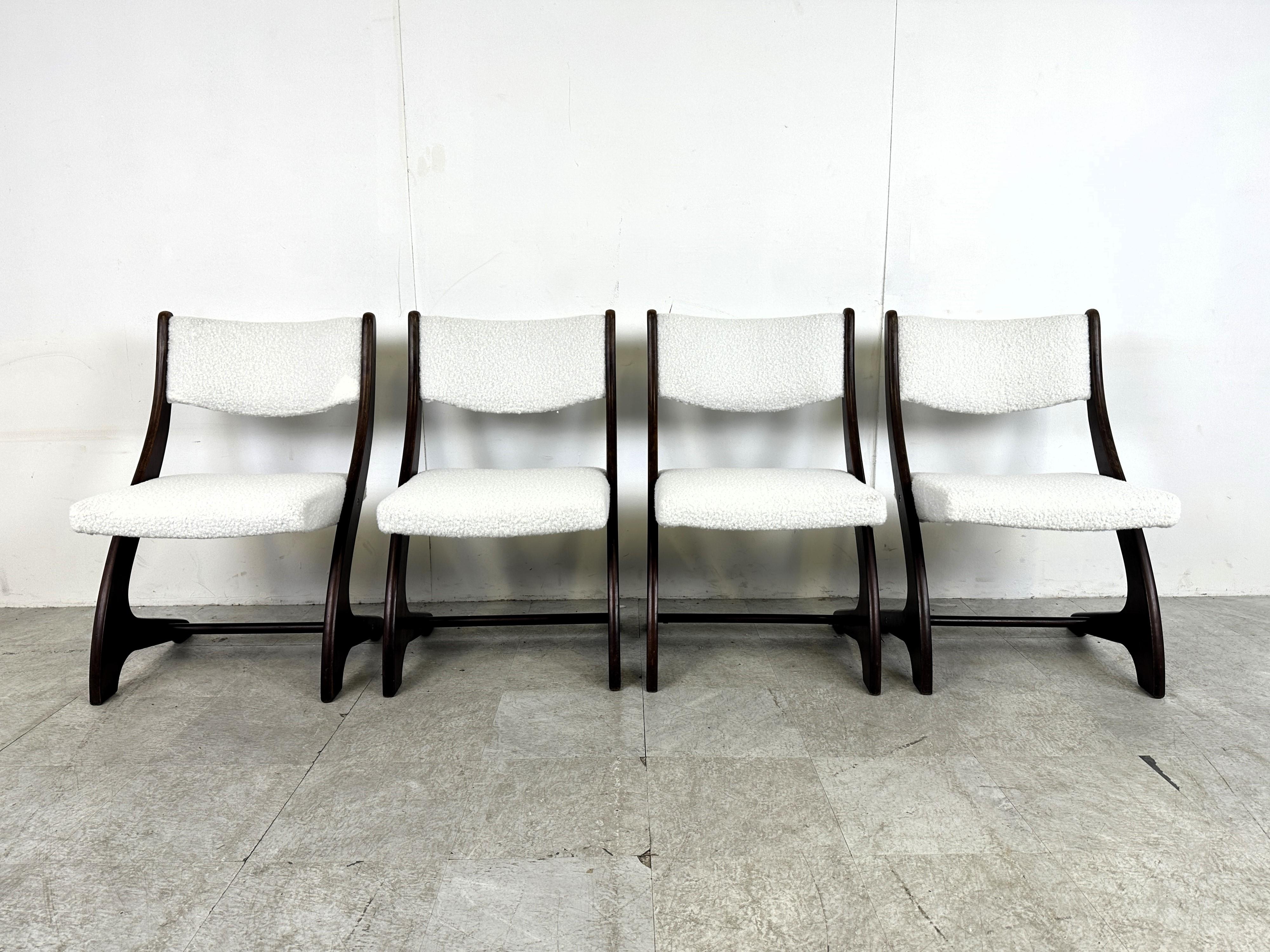 Set of 4 wooden scandinavian dining chairs with new bouclé upholstery.

The chairs are very elegantly designed with the beautifully curved wooden frame.

1960s - Denmark

Height: 85cm/33.46