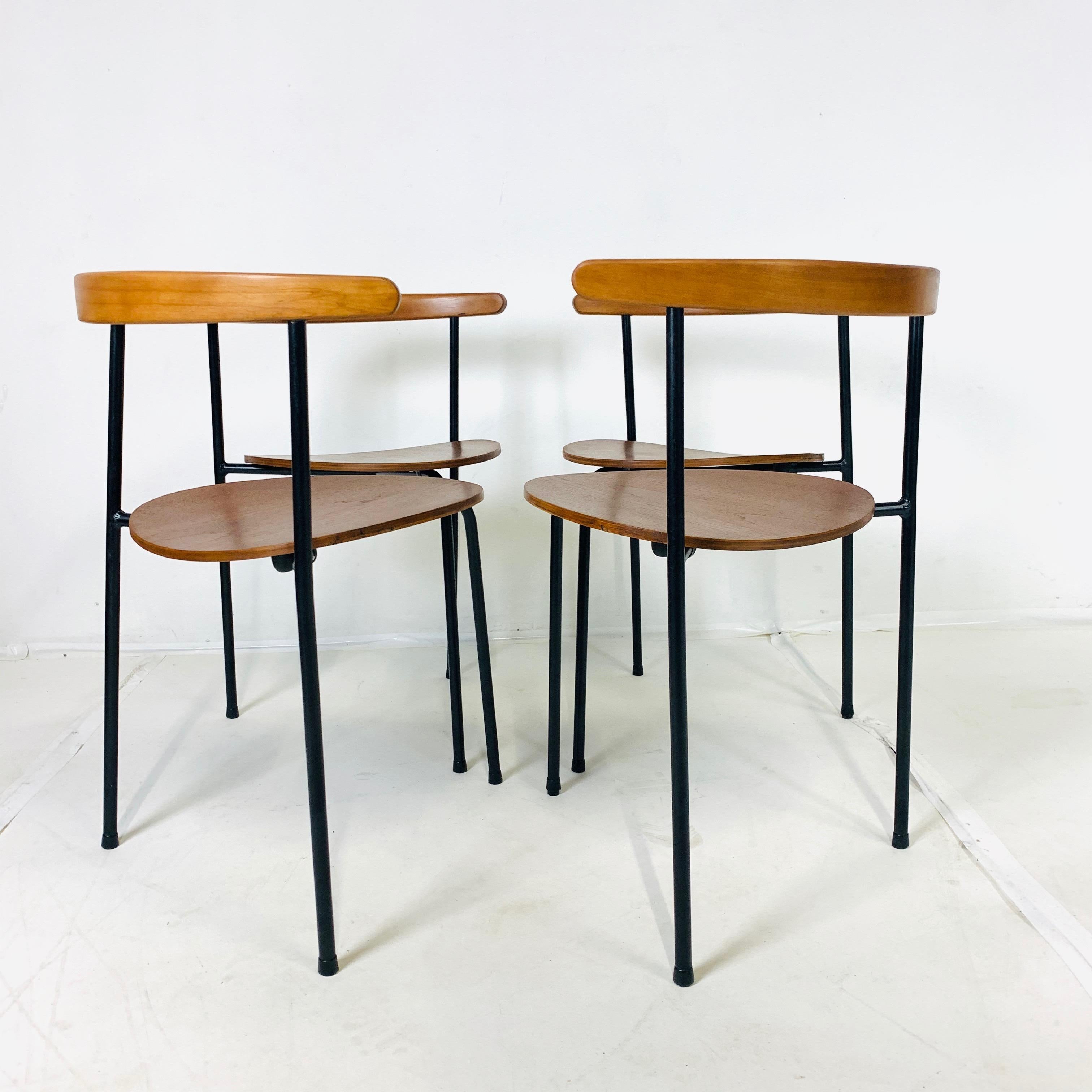 Scandinavian Modern Set of 4 Scandinavian Stacking 3- Legged Teak, Beech, and Metal Dining Chairs