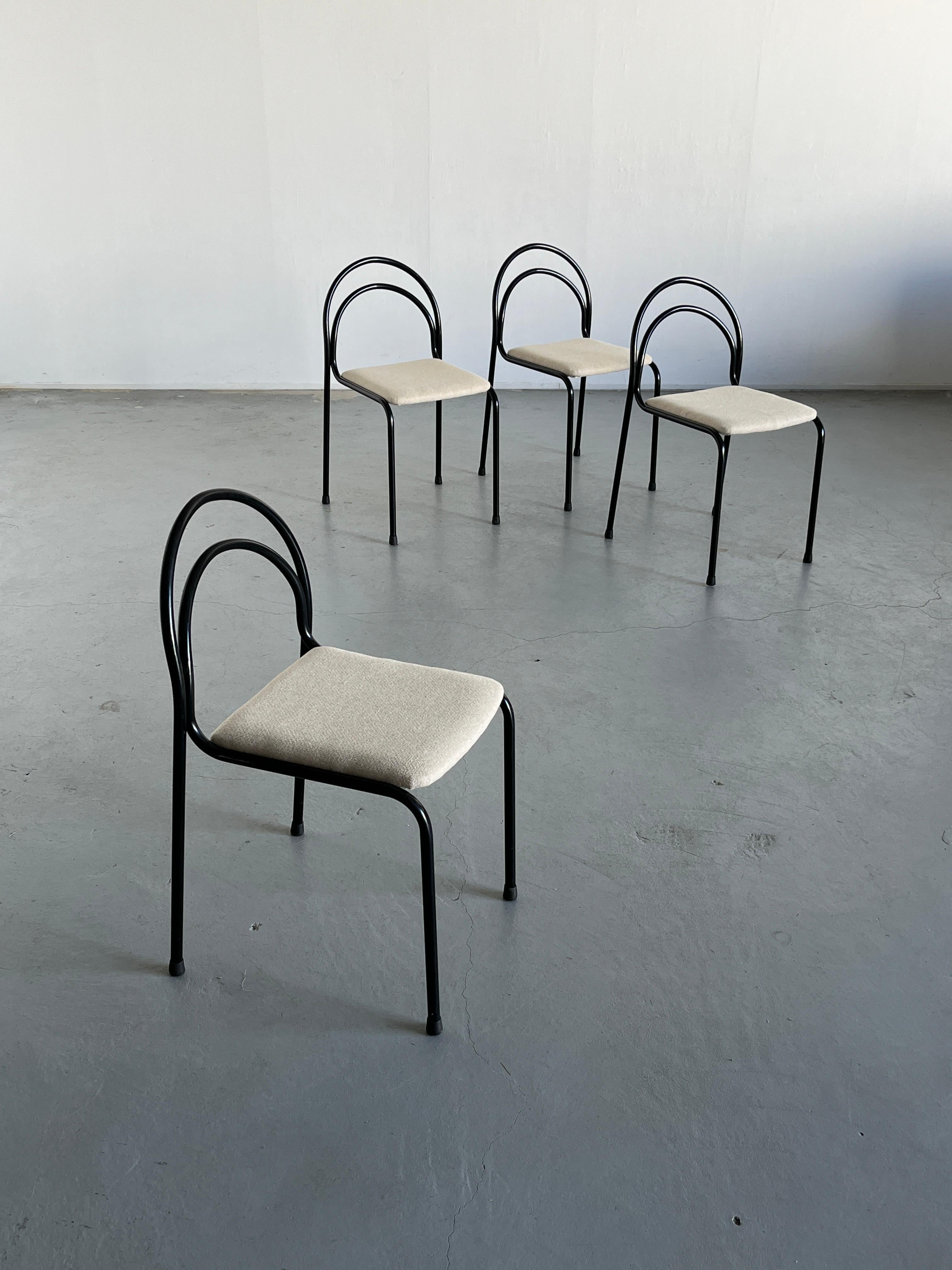 Set of four Mid-century modern dining chairs produced in Italy in the 1990s. 
Sculptural design, black curved iron frame and off-white knitted wool upholstery.

Sold as a set of four pieces.

Chairs are in very good vintage condition with expected
