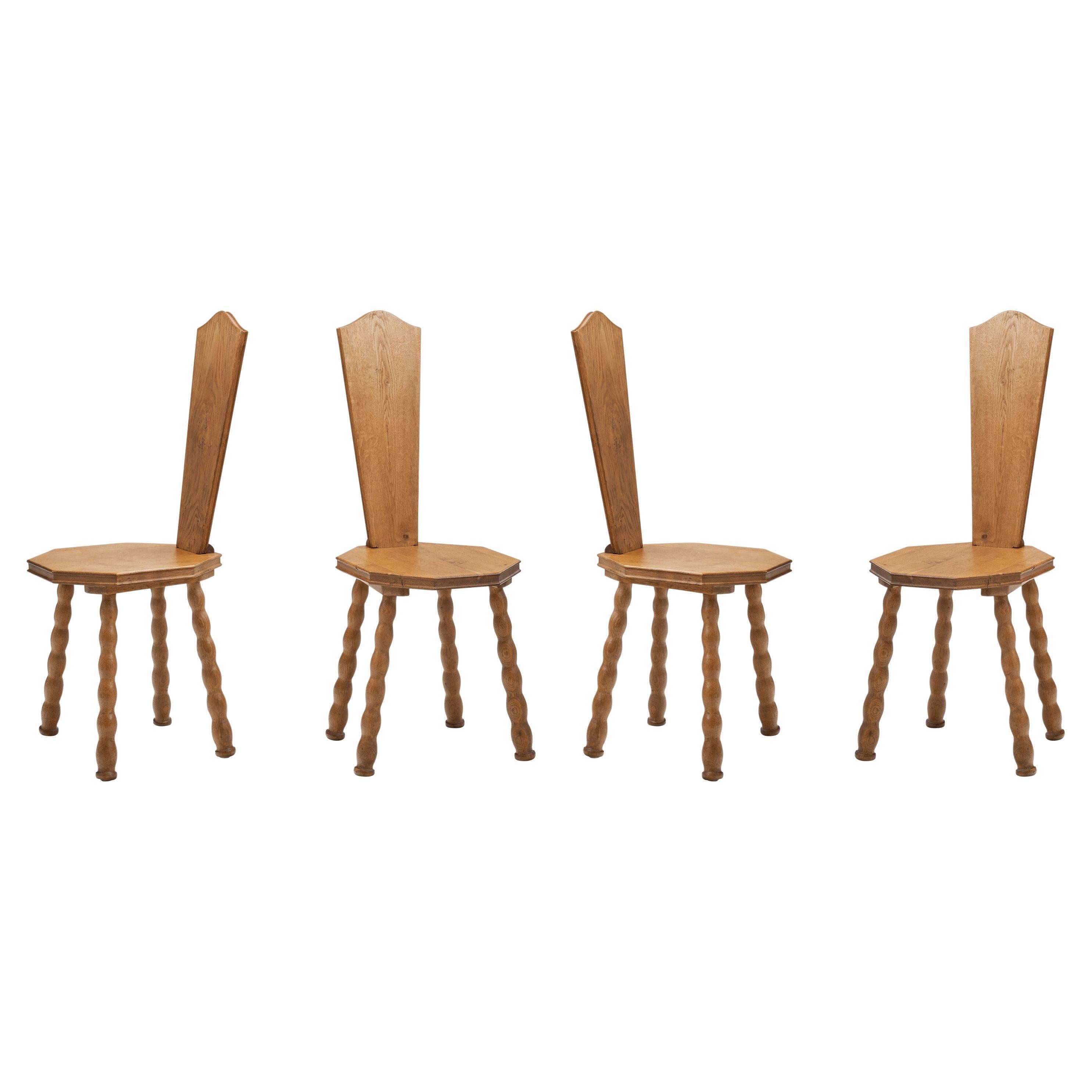 Set of 4 Sculptural Patinated Oak Spinning Chairs, Europe ca early 20th century For Sale