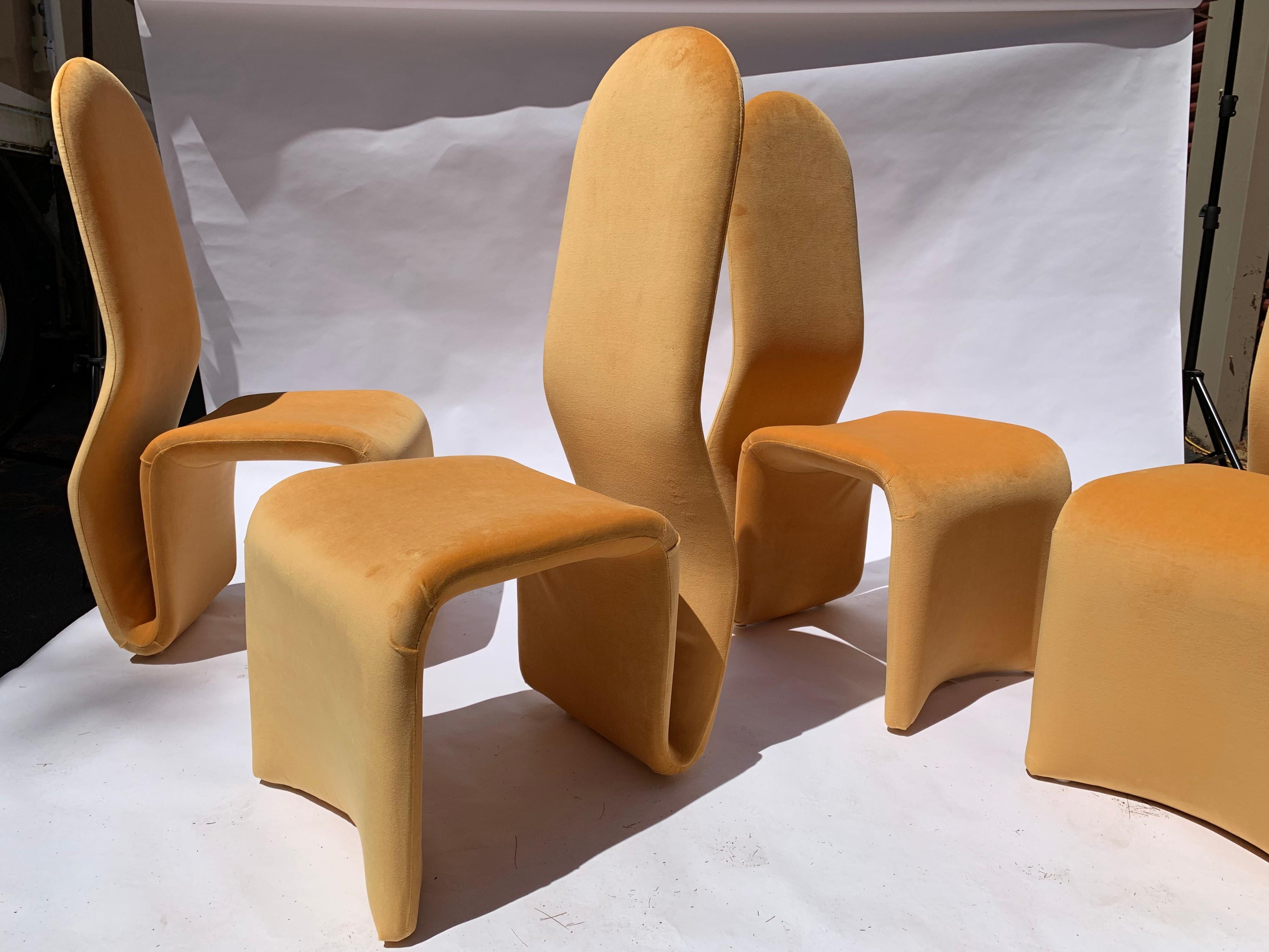A beautiful set of sculptural dining chairs after Olivier Mourgue having steel pipe framing, slings for support and new upholstery. Excellent condition, circa 1975.