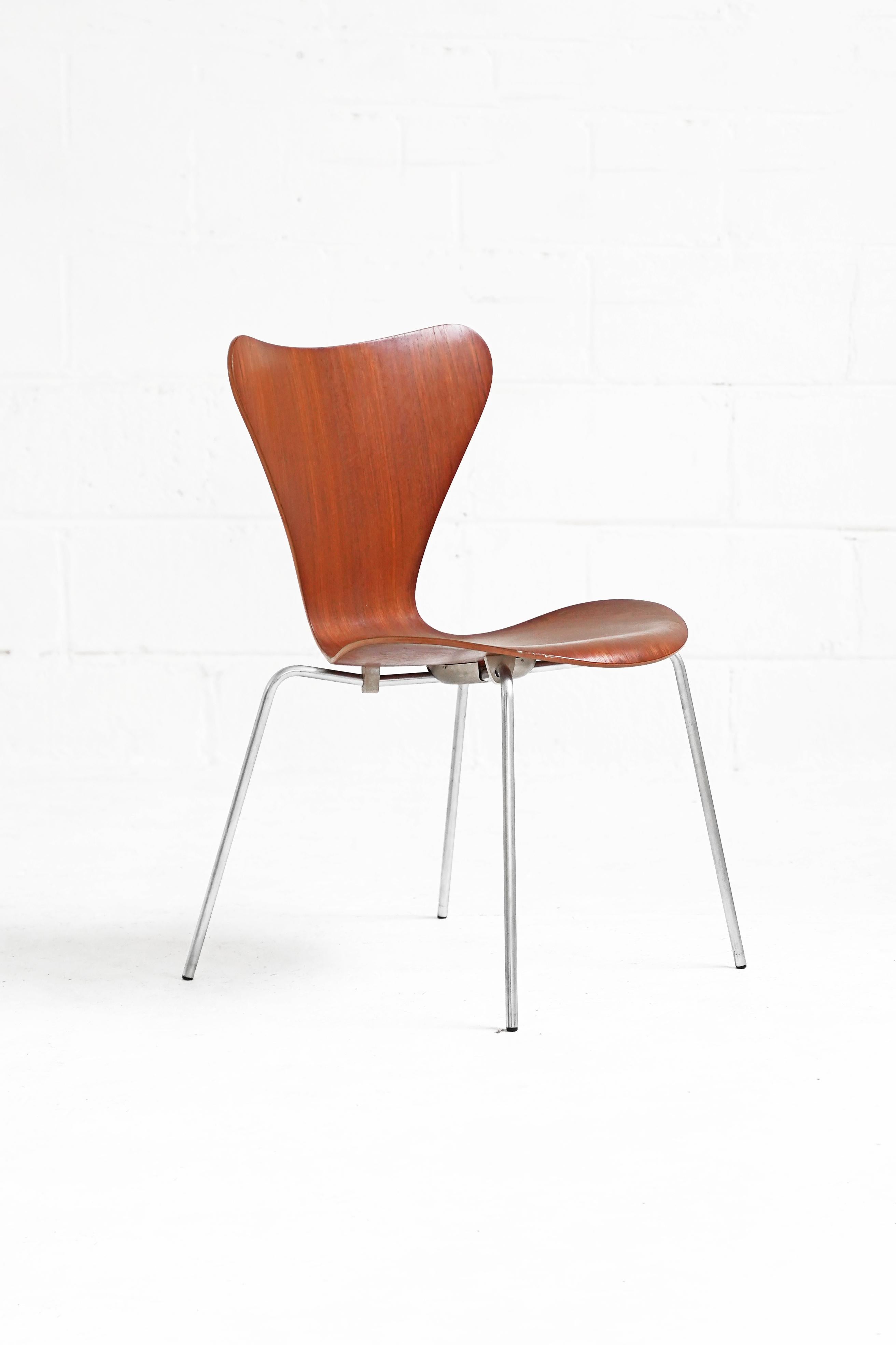 1955-1959 production, First Edition. Stamped metal (not plastic) base caps with original Fritz Hansen (FH) engraving and serial codes for each chair. Original molded plywood seat, rubber base mounts and nickel plated legs in amazing vintage original