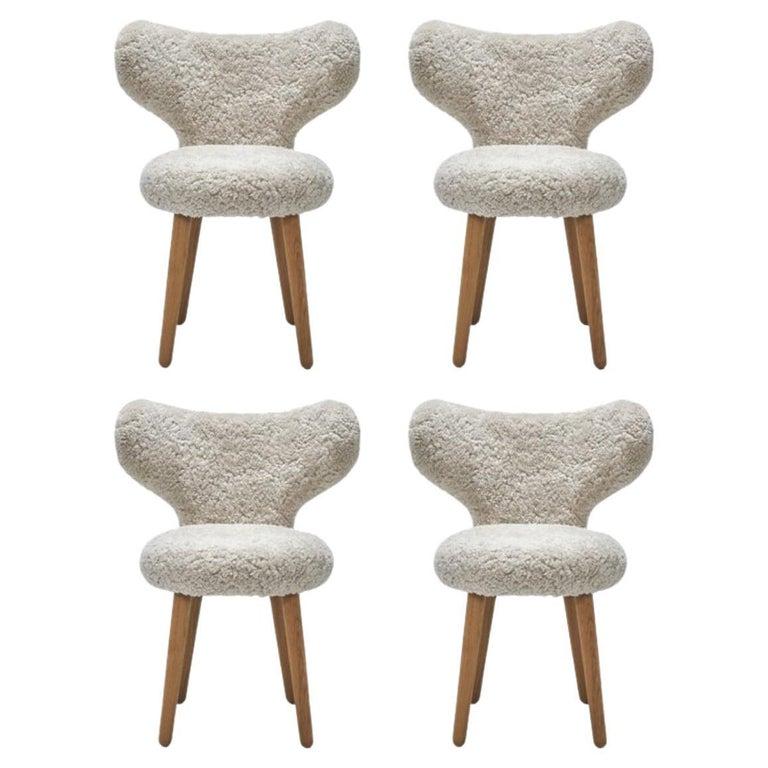 Set of 4 sheepskin WNG chairs by Mazo Design
Dimensions: W 60 x D 50 x H 76 cm
Materials: oak, sheepskin. 
Also available: DAW/Royal, KVADRAT/Hallingdal & Fiord, BUTE/Storr, KVADRAT/ Vidar, DAW/Mcnutt, DEDAR/Artemidor.

The WNG Chair’s rounded