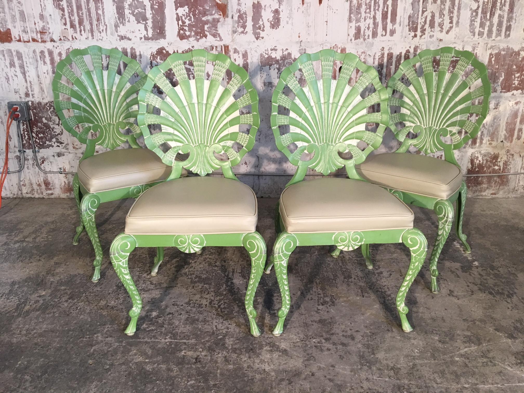 Set of 4 Brown Jordan cast aluminum grotto chairs in gorgeous green with white detailing. Beautiful shell back design in excellent vintage condition. Structurally sound with minor age appropriate signs of use. Vinyl upholstery in excellent
