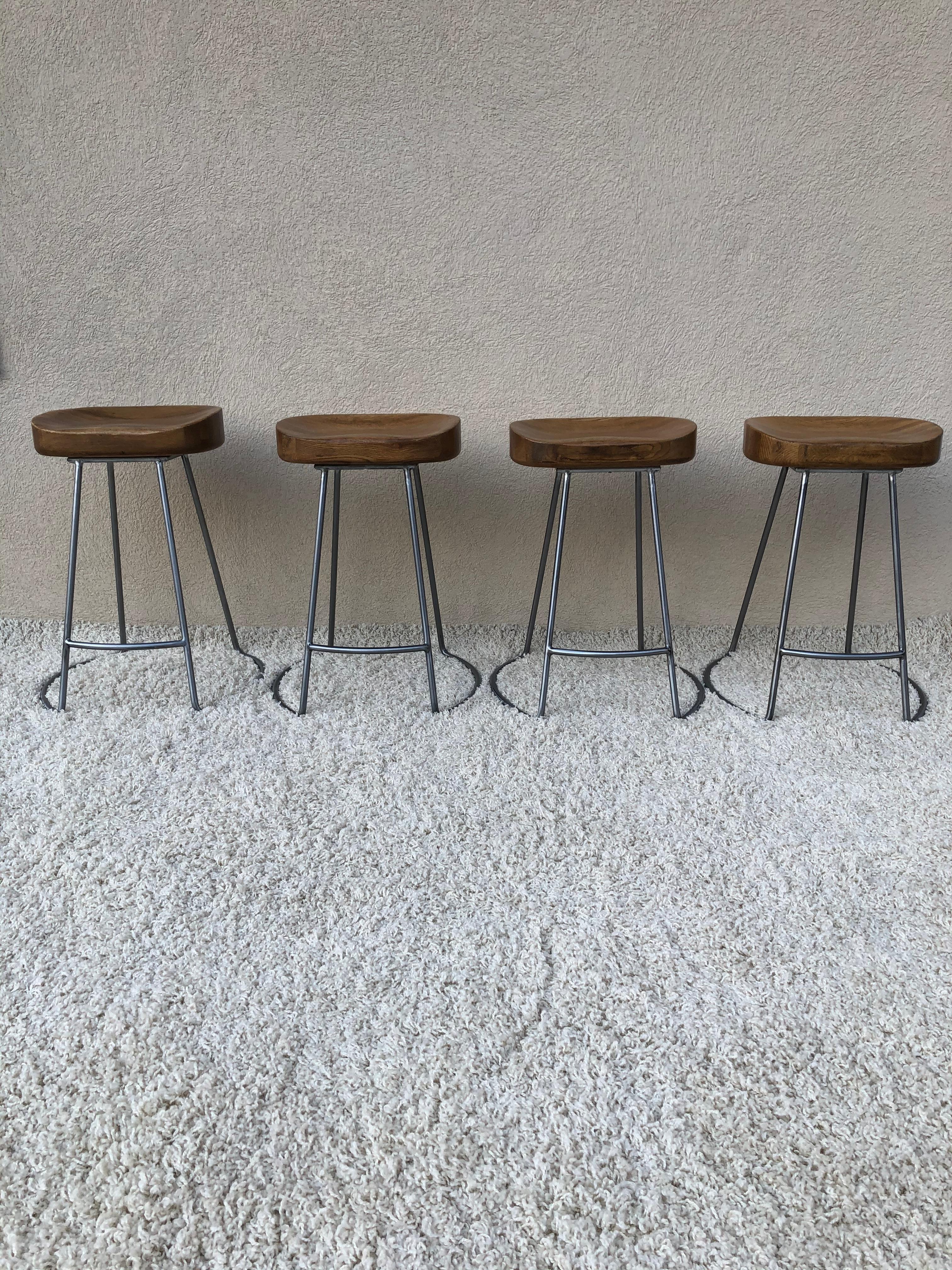 Set of 4 vintage solid steel color, these stools are silver metal bases. Brushed polished finish stools counter stools/ bar stools, with heavy solid oak tops. Stools appear to be early design I have seen others similar but this weight is 20lbs each
