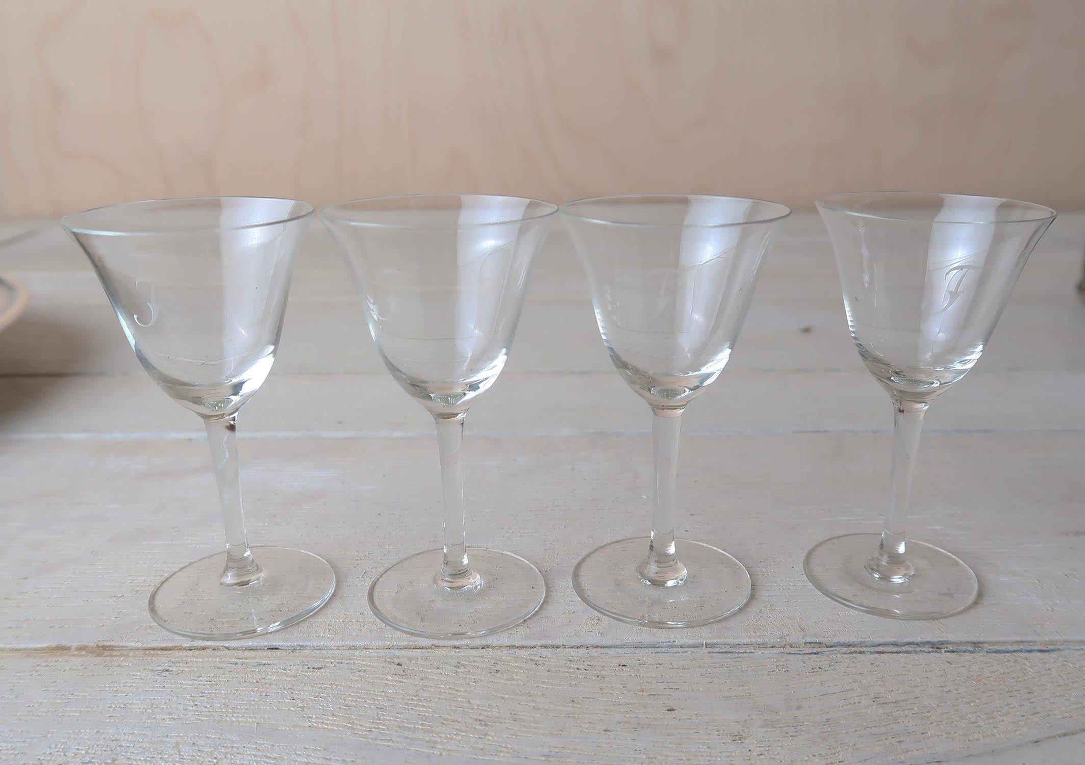 Nice set of 4 of the finest glasses. 

Each one engraved with the letter 