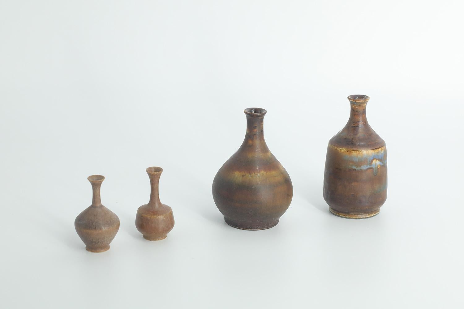  1. Height 8.5 cm | Width 4.5 cm | Depth 4.5 cm
2. Height 8 cm | Width 5 cm | Depth 5 cm
3. Height 5 cm | Width 3 cm | Depth 3 cm
4. Height 5 cm | Width 2.5 cm | Depth 2.5 cm

This set of 4 miniature vases was designed by Gunnar Borg for the Swedish