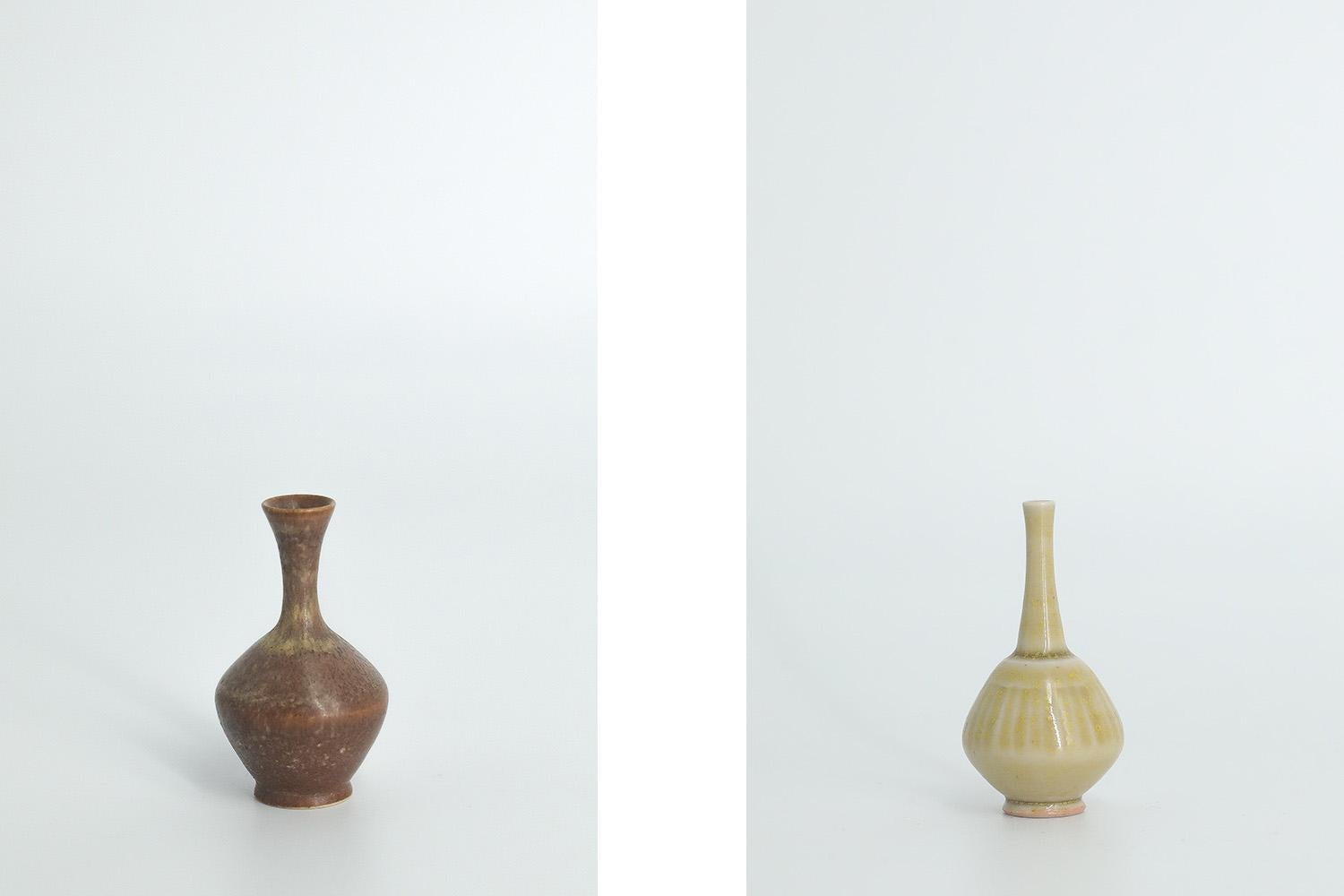 1. Height 8.5 cm | Width 6 cm | Depth 6 cm
2. Height 8.5 cm | Width 5.5 cm | Depth 5.5 cm
3. Height 5 cm | Width 3 cm | Depth 3 cm
4. Height 4.5 cm | Width 2.5 cm | Depth 2.5 cm

This set of 4 miniature vases was designed by Gunnar Borg for the