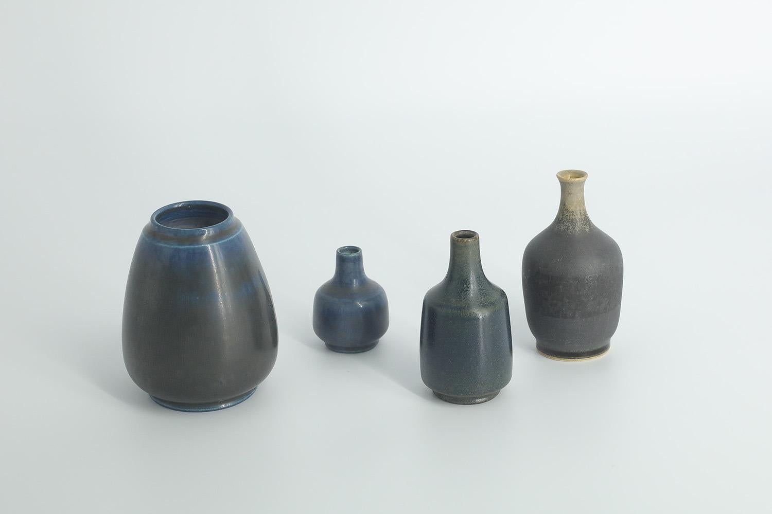 1. Height 8 cm | Width 6 cm | Depth 6 cm
2. Height 8 cm | Width 3.5 cm | Depth 3.5 cm
3. Height 7 cm | Width 3.5 cm | Depth 3.5 cm
4. Height 4.5 cm | Width 3 cm | Depth 3 cm

This set of 4 miniature vases was designed by Gunnar Borg for the Swedish