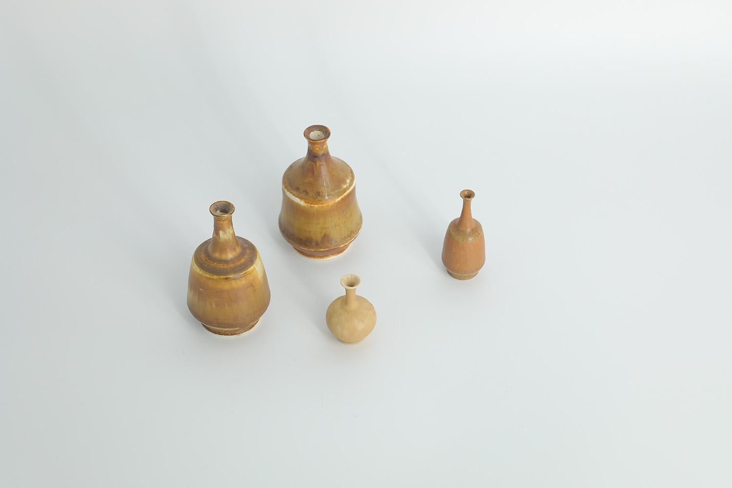 1. Height 8 cm  Width 5 cm  Depth 5 cm
2. Height 7.5 cm  Width 5 cm  Depth 5 cm
3. Height 6 cm  Width 2.5 cm  Depth 2.5 cm
4. Height 4 cm  Width 3 cm  Depth 3 cm

This set of 4 miniature vases was designed by Gunnar Borg for the Swedish manufacture