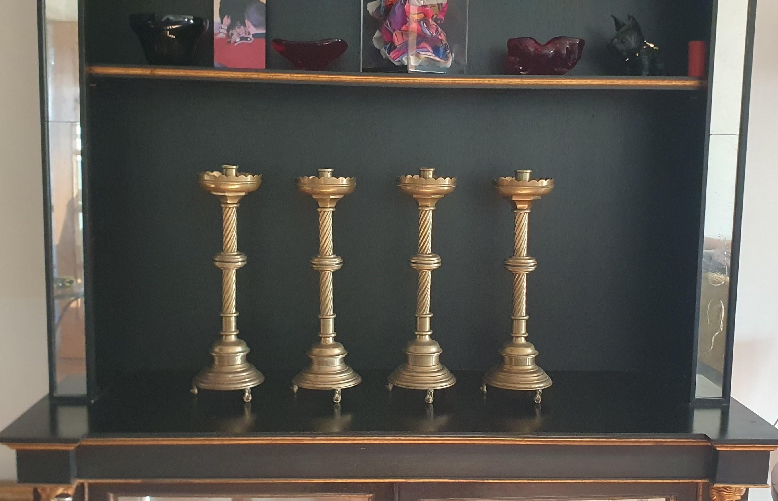 
A set of four very heavy tall cast Brass Church style candlesticks, a stunning addition to any festive table setting or mantle piece

These sturdy and solid candlesticks are in Antiqued Brass finish, 13cm Wide x 42cm High and each weighs 2.83Kg and