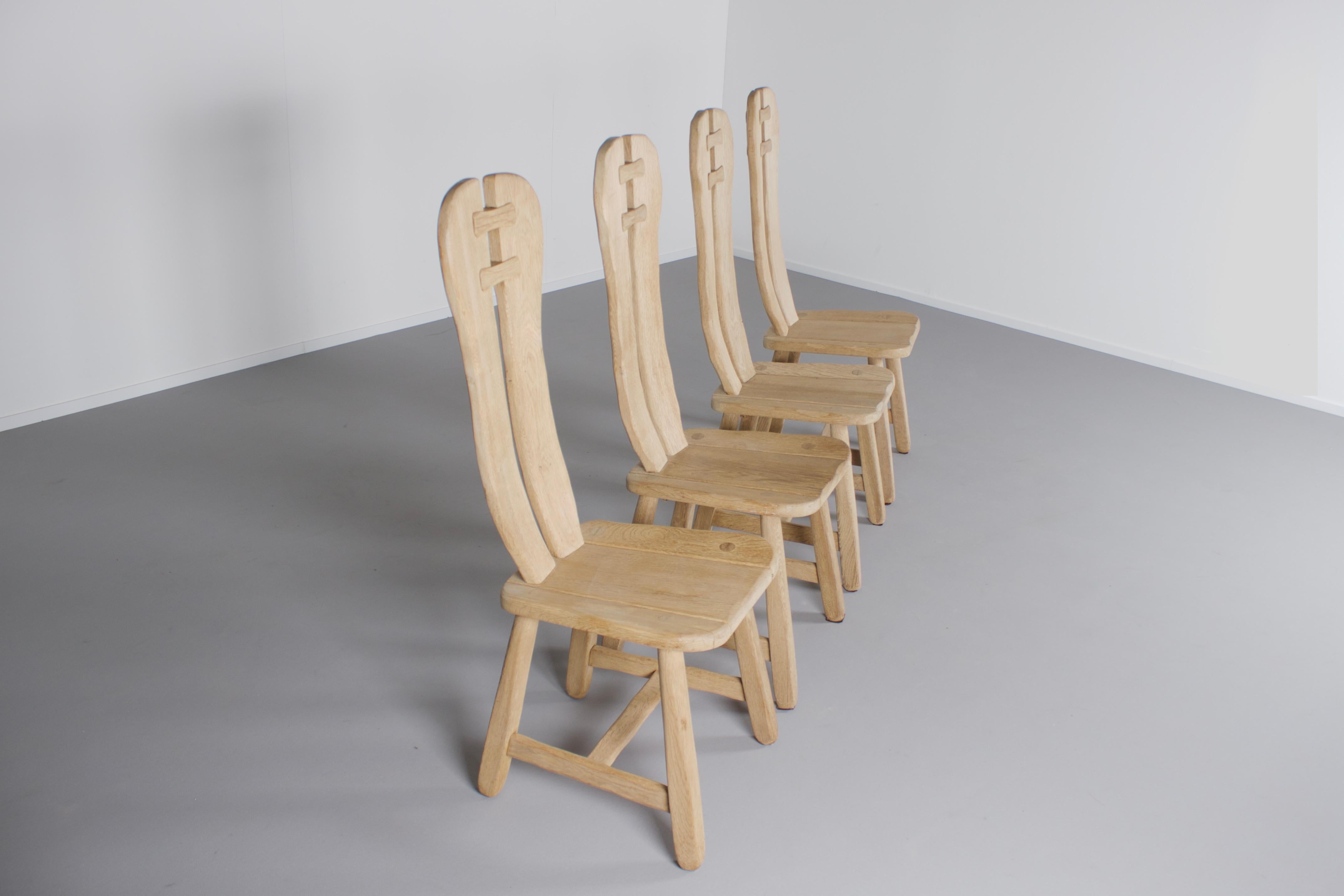 Very impressive sculptural chairs in very good condition. 

These chairs were made in the 1970s in Belgium by De Puyt.

They are made of solid oak wood and constructed with beautiful visible joints. 

The curved seat and back make these chairs very