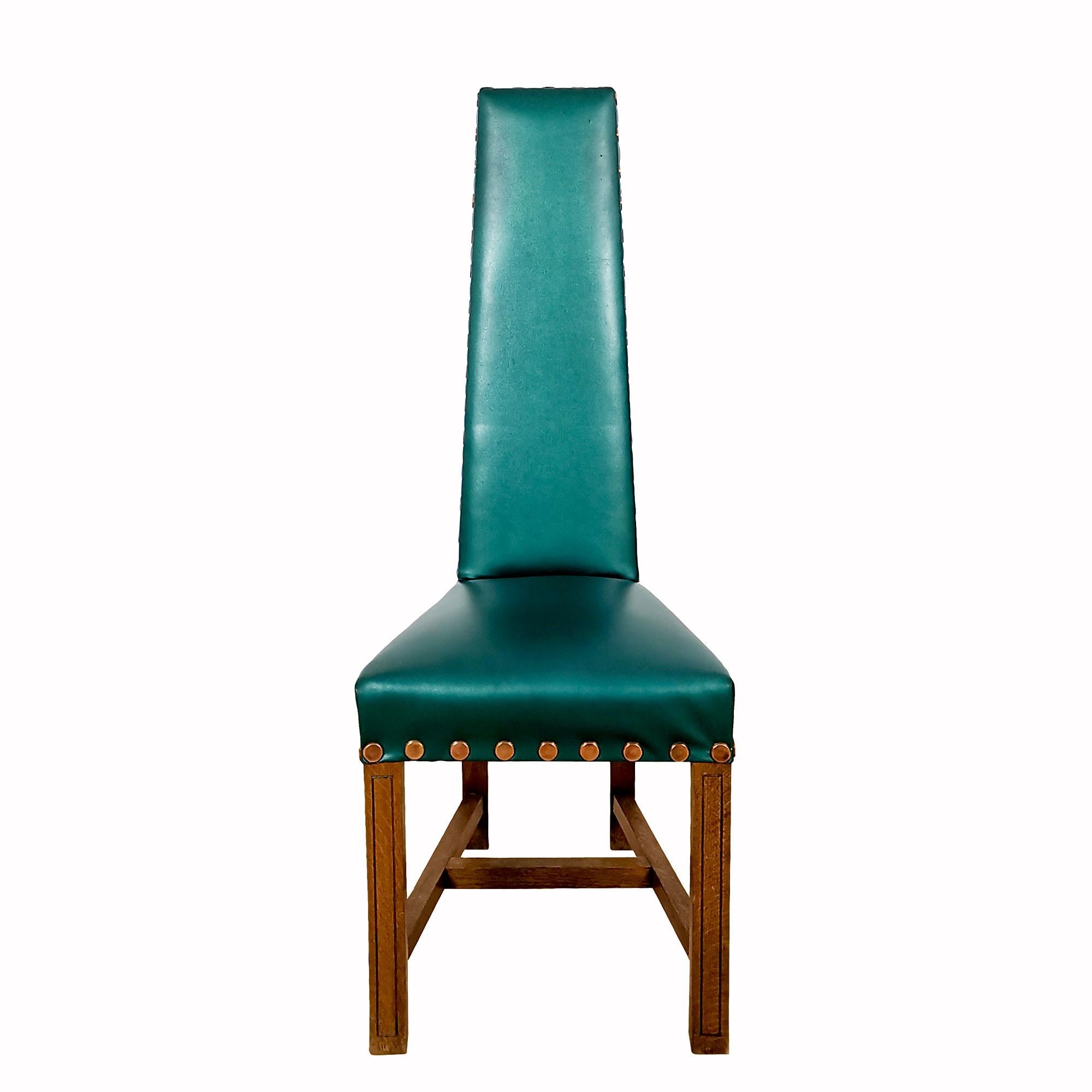 Set of 4 solid oak chairs with high backs, original blue-turquoise skai (faux leather) upholstery. Polished brass finishing large studs. 

Spain c. 1960.