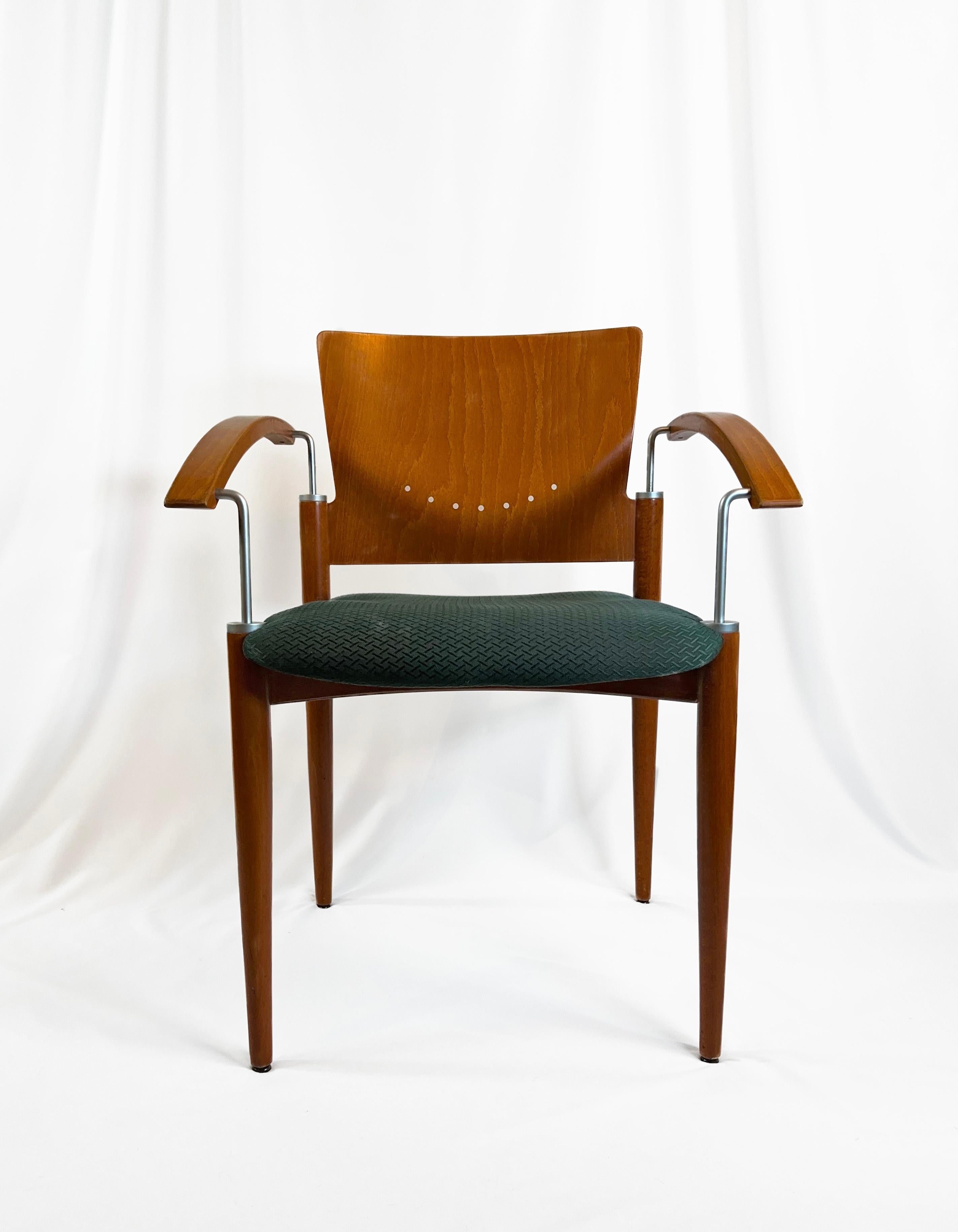 A collection of four Postmodern stackable dining chairs, attributed to Thonet, circa 1980s.

These chairs have been crafted using a blend of Beech Ply and Beech Wood, skilfully juxtaposed with contemporary metal rod accents.

Sweeping, curved beech