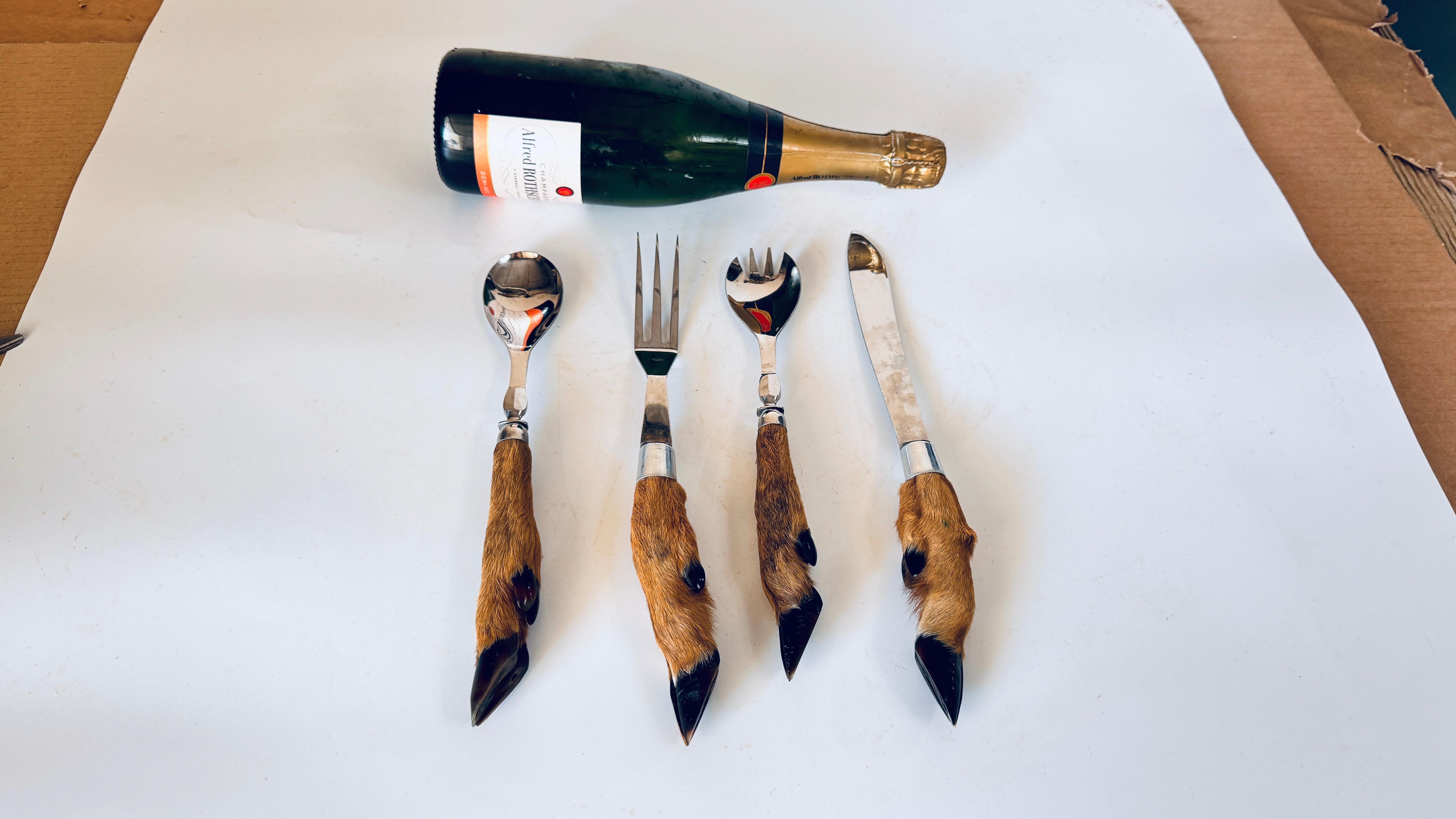 Set of Four Stainless Steel Serving Utensils with Stag Handle, Game & Salad Service

This set of four stainless steel serving utensils, designed for meat, game, or salad service, is both functional and highly decorative. Featuring a carving set for