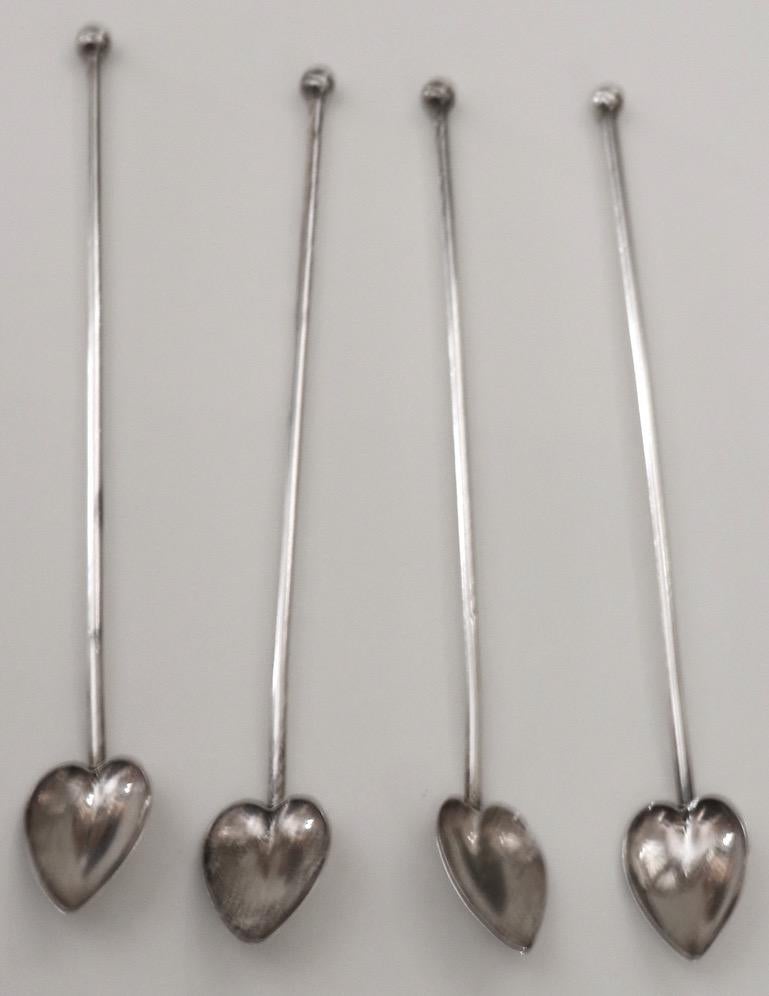 Set of four sterling silver drink stir stick, straws, having a long silver tube with leaf form bowl at the bottom. Marked Riamond Sterling. Priced and offered as a set.