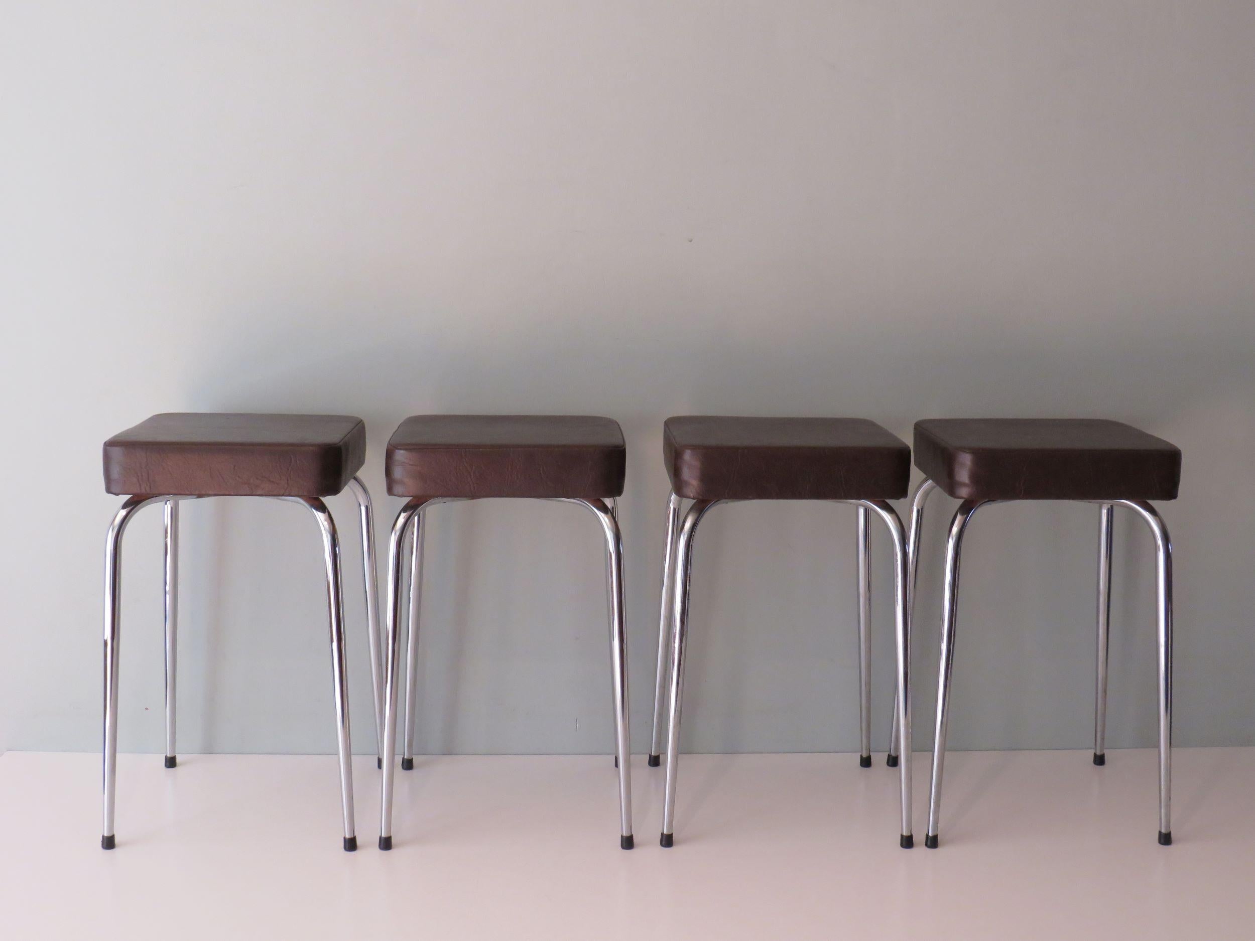 Nice set of 4 stools, the stools have a fairly thick seat which ensures good seating comfort.
All four have their original dark brown imitation leather upholstery and original caps at the bottom of the tapered legs.
The chairs are crosswise