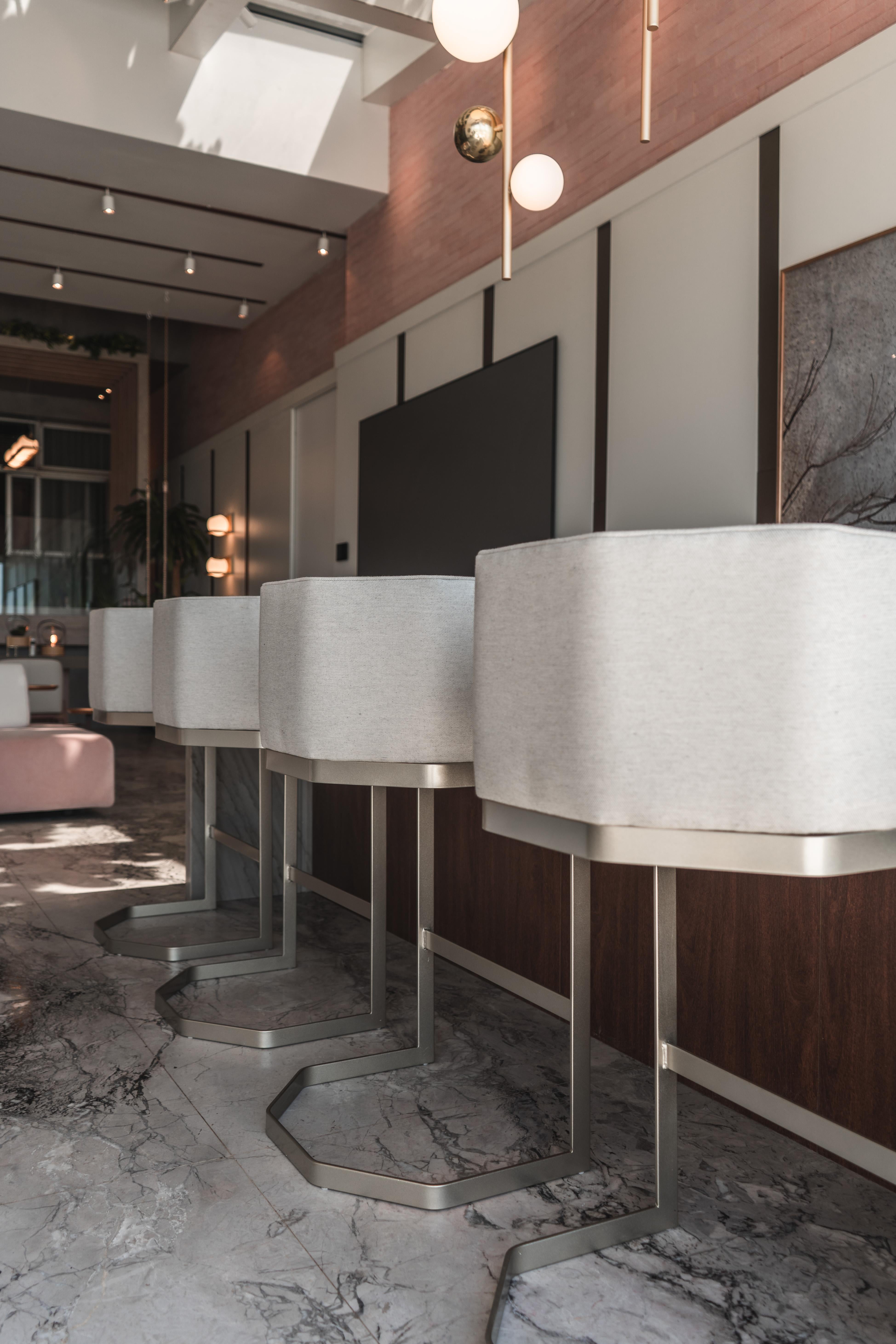 The set of 4 stools is upholstered in fabric like a linen, with champagne-colored metallic feet made of carbon steel. (as the photo in the environment).

We can deliver the set with waterproof treatment (request the service and quote)

The stools
