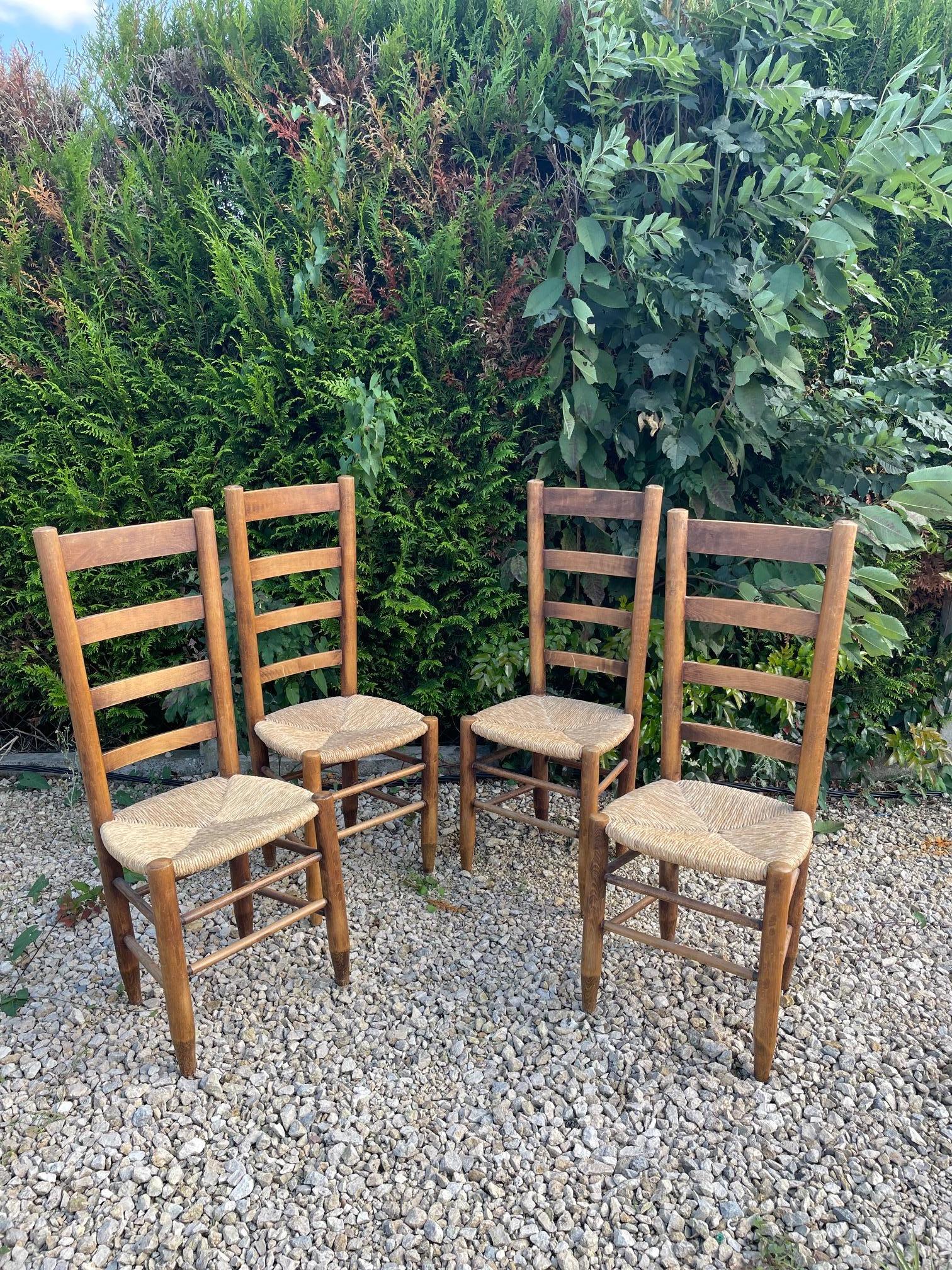 Set of 4 Straw Chairs in the style of  Charlotte Perriand In Good Condition For Sale In Brooklyn, NY