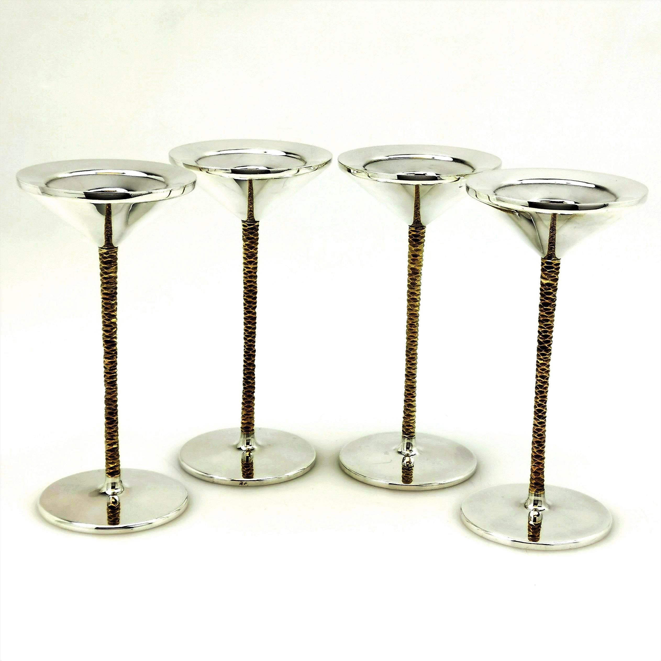 A magnificent Set of Antique solid Silver parcel gilt Candlesticks made in the archetypal style of Stuart Devlin. The Candlesticks have conical base and capital in highly polished silver and have gilded, textured columns. Each Candlestick comes in